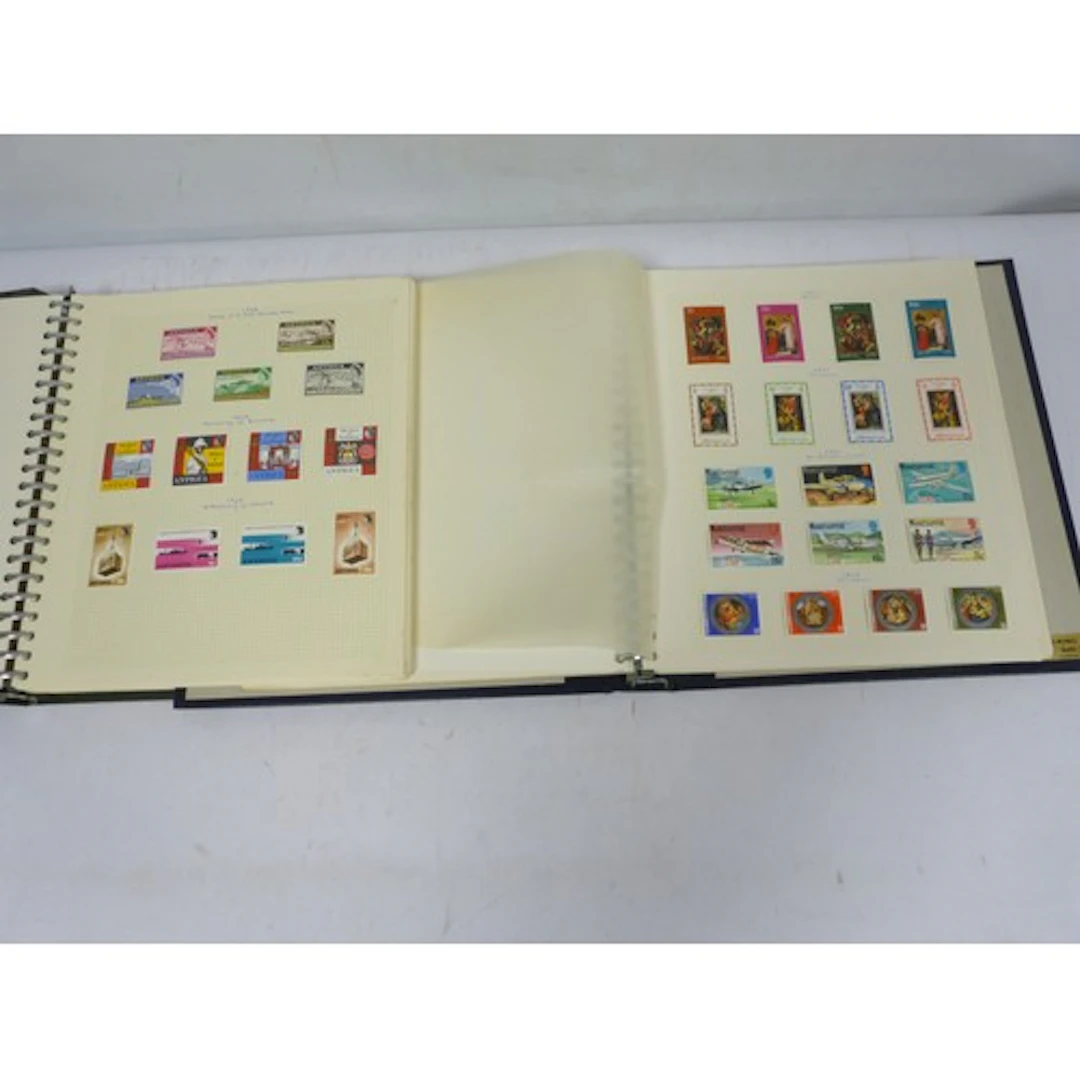 Two vintage stamp albums to include Antigua and West Indies/...