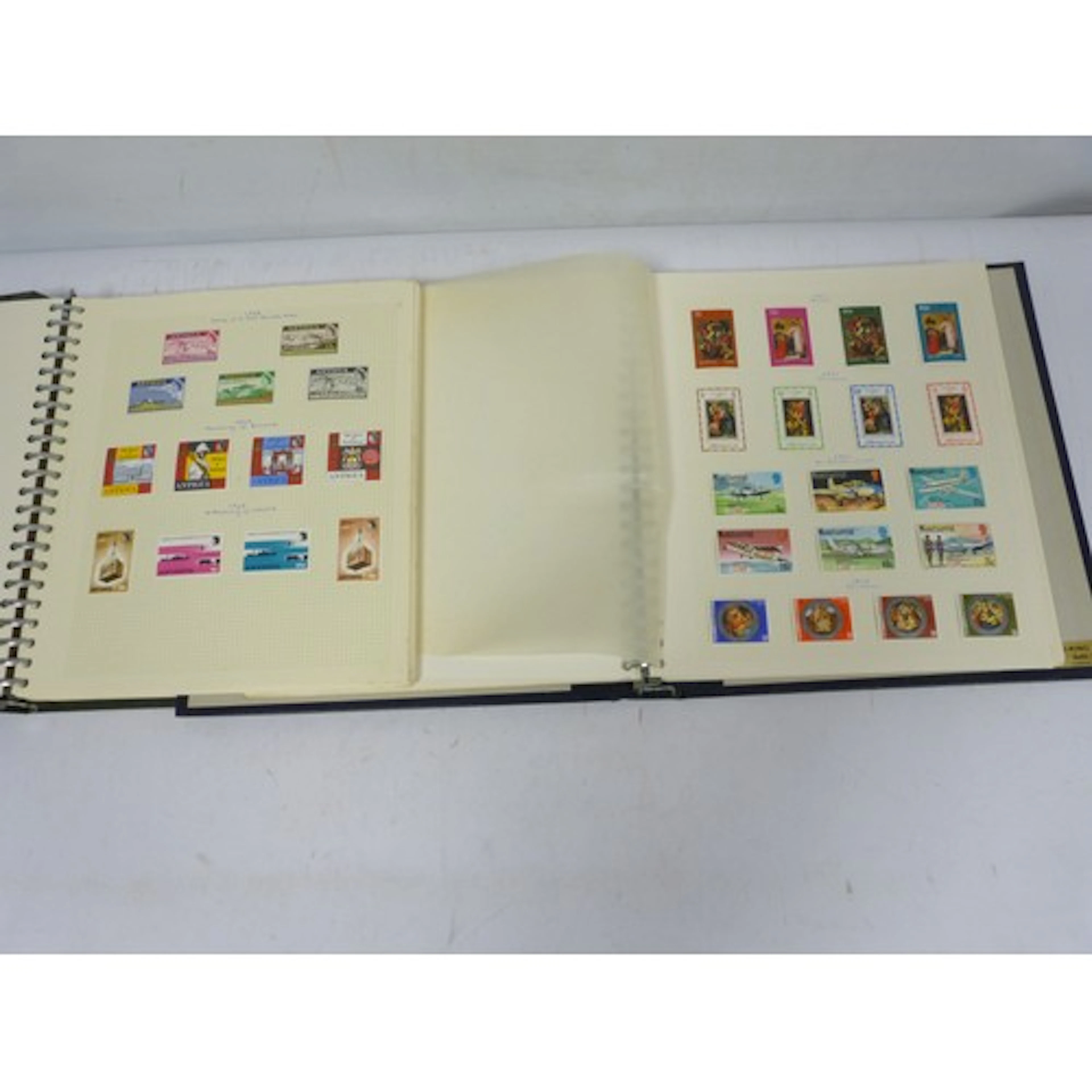 Two vintage stamp albums to include Antigua and West Indies/...