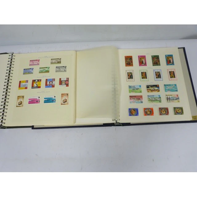 Two vintage stamp albums to include Antigua and West Indies/...