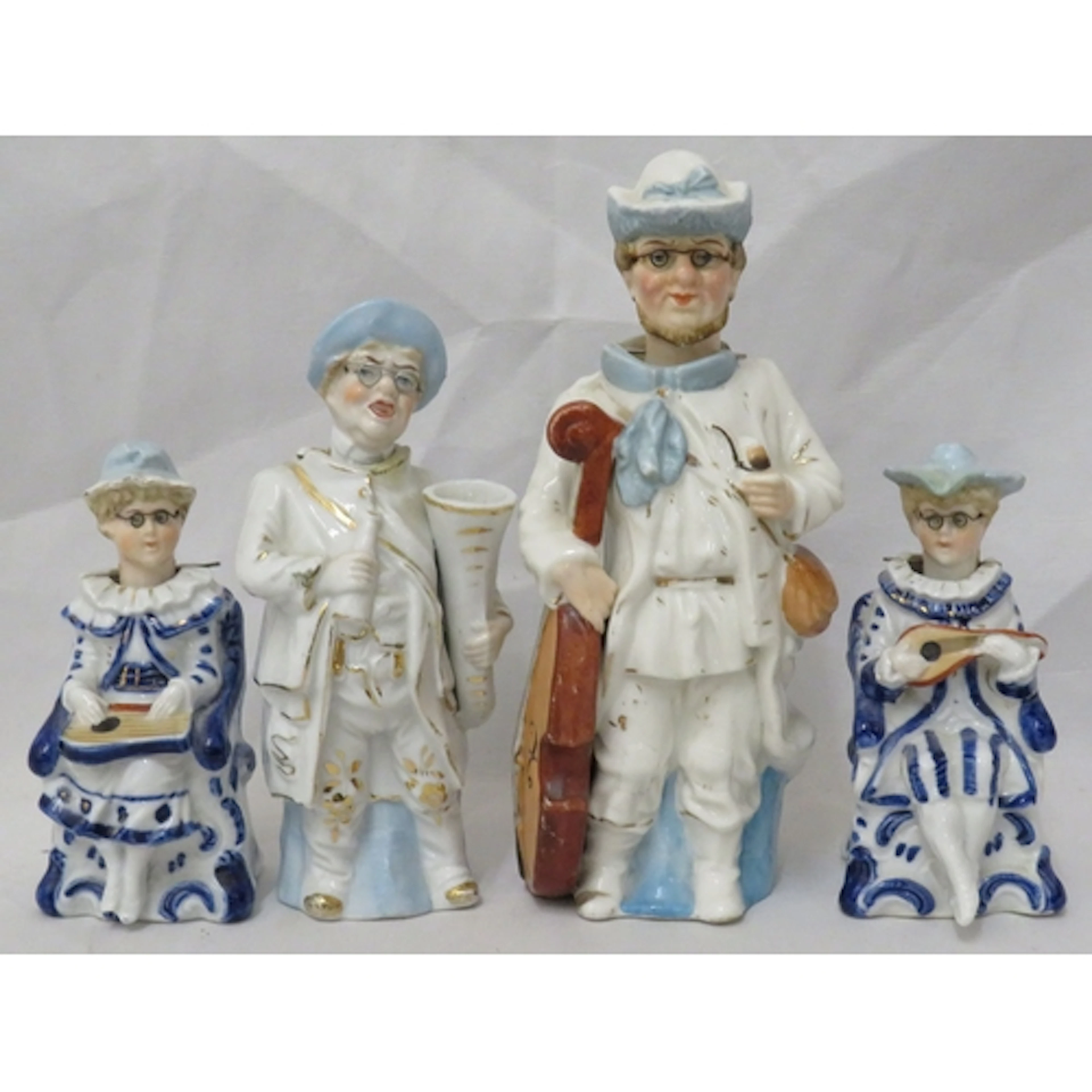 4 Glazed Bisque Nodding Head Figurines, musicians incl. oboe...