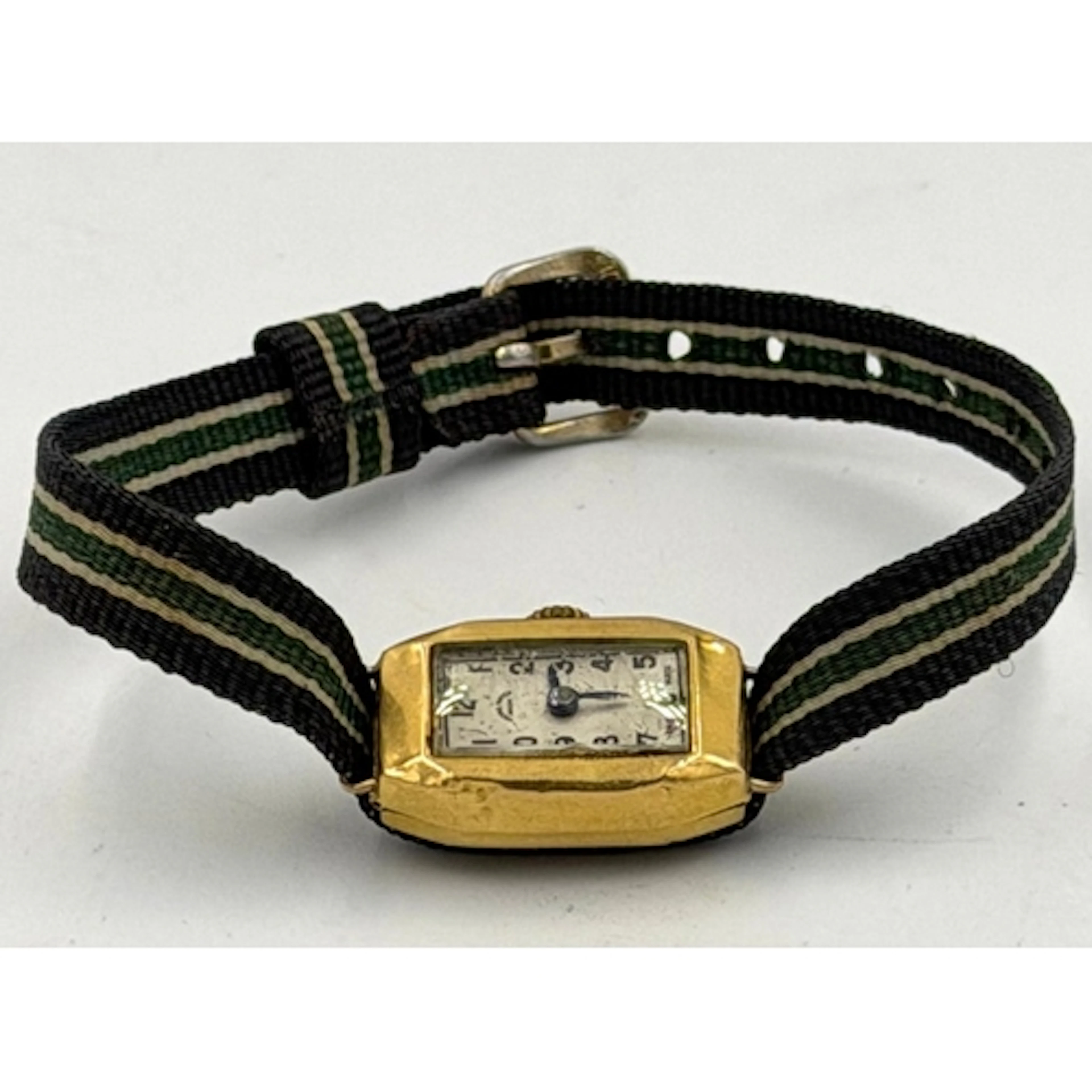 An 18ct gold Metro watch on fabric strap, approximate watch ...
