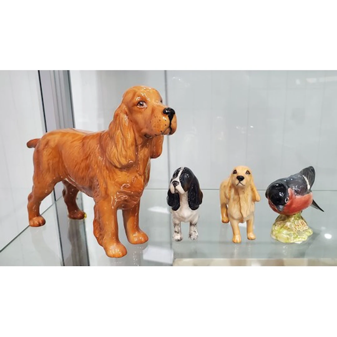 A Beswick Cocker Spaniel "Horseshoe Primula" two other Beswi...