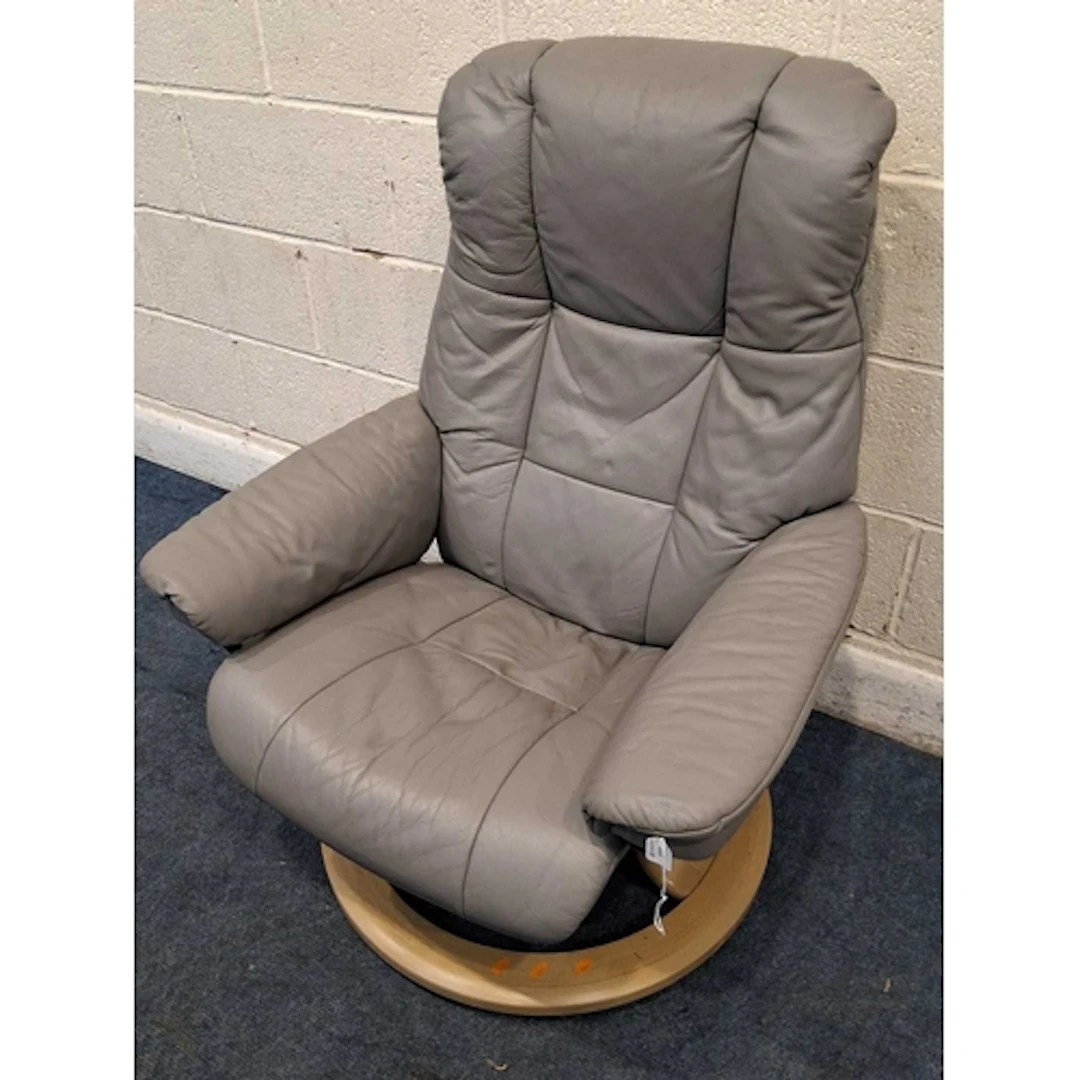 AN EKORNES STRESSLESS GREY LEATHER SWIVEL RECLINING ARMCHAIR...