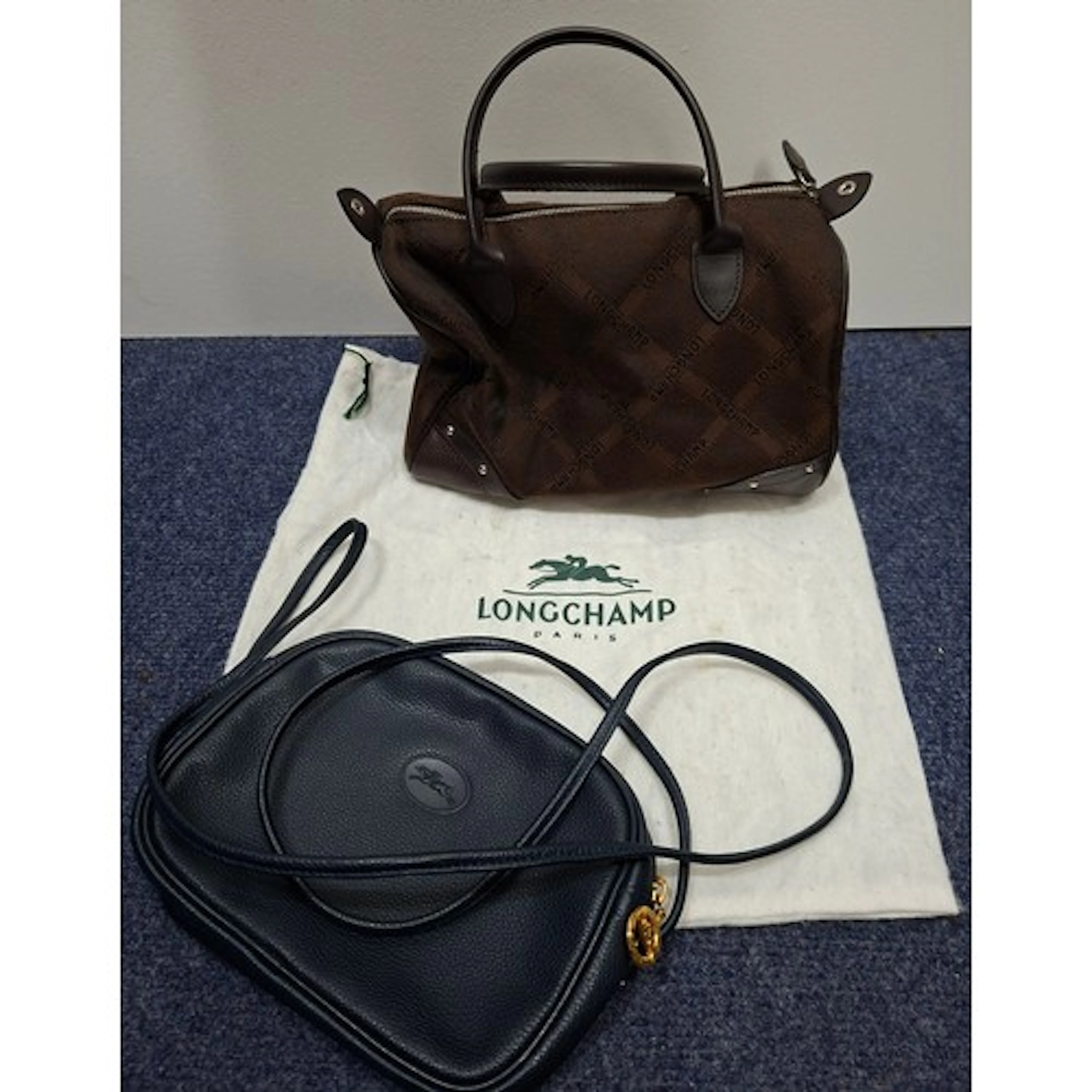 Longchamp- A small navy textured leather crossover bag appro...