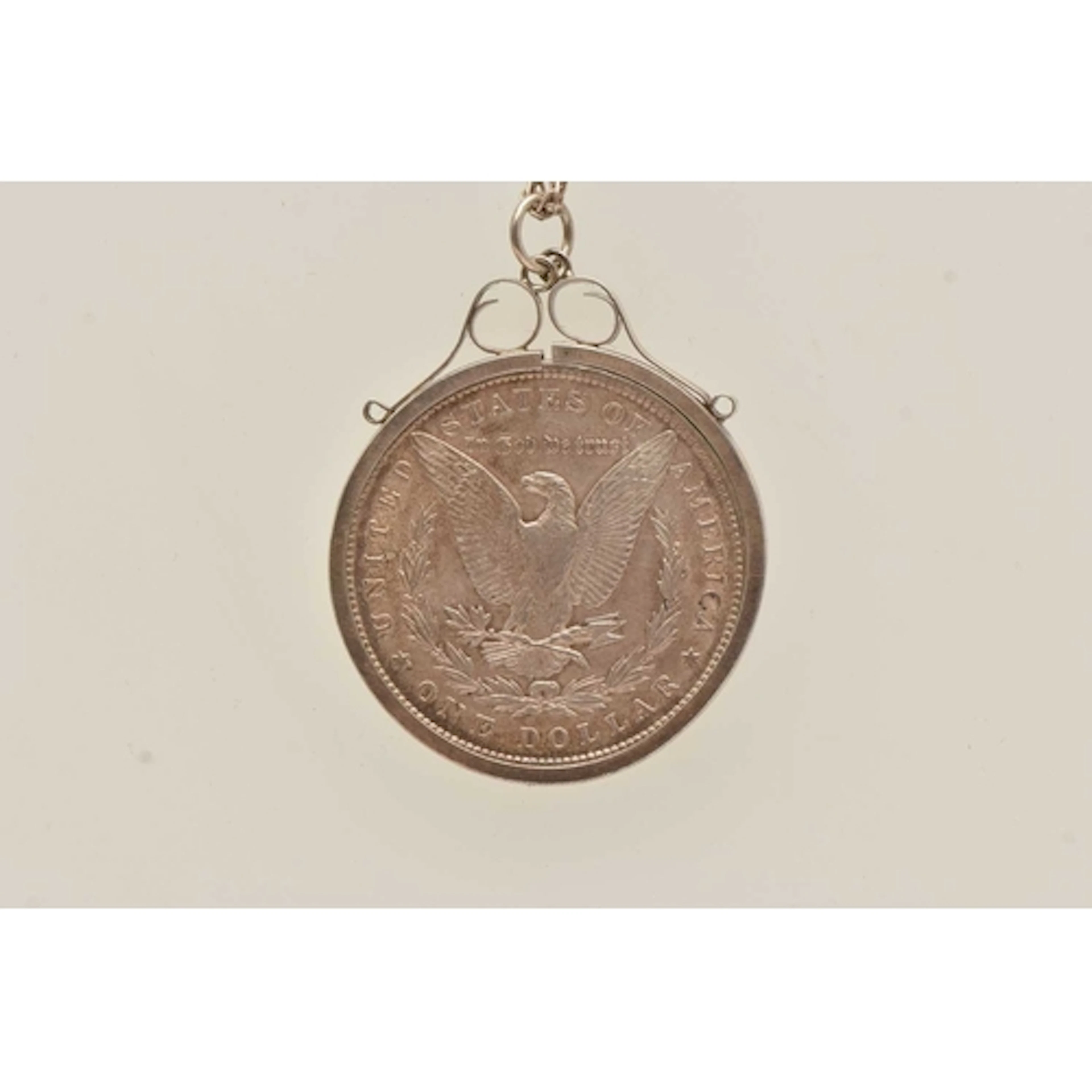 A MOUNTED COIN NECKLACE, a United States One Dollar coin mou...