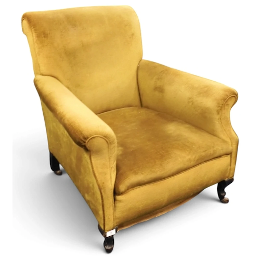 A late 19th century lounge armchair upholstered in mustard v...