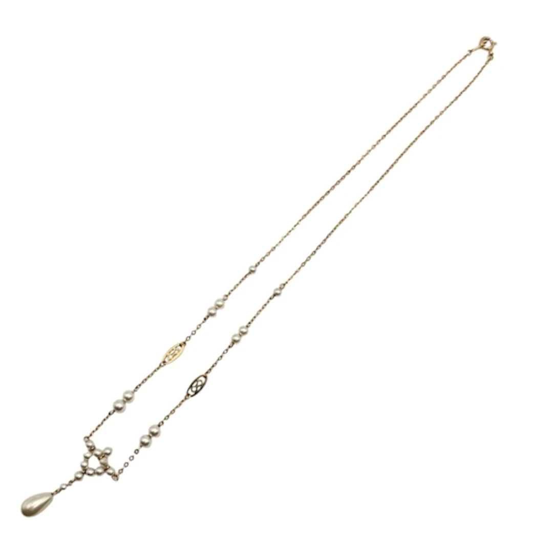 AN EDWARDIAN 9CT GOLD AND SEED PEARL FESTOON NECKLACE. Stam...