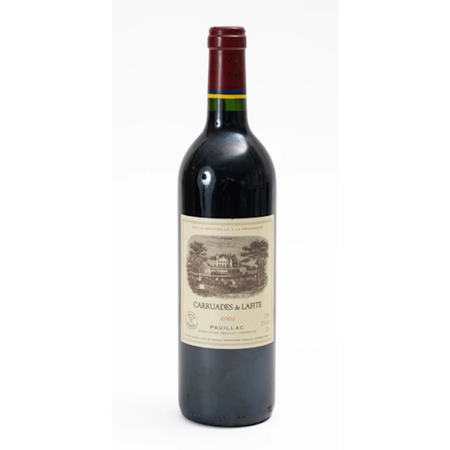 A bottle of Carrudes de Lafite Pauillac 2002. Fill level to ...