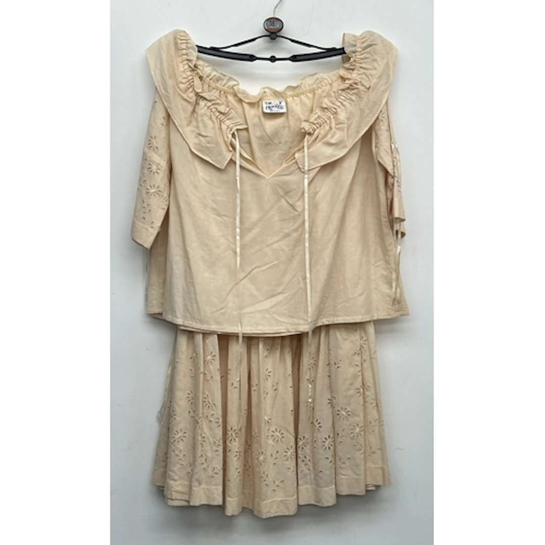 A vintage Cherry Frizzell cream skirt and top, size 1