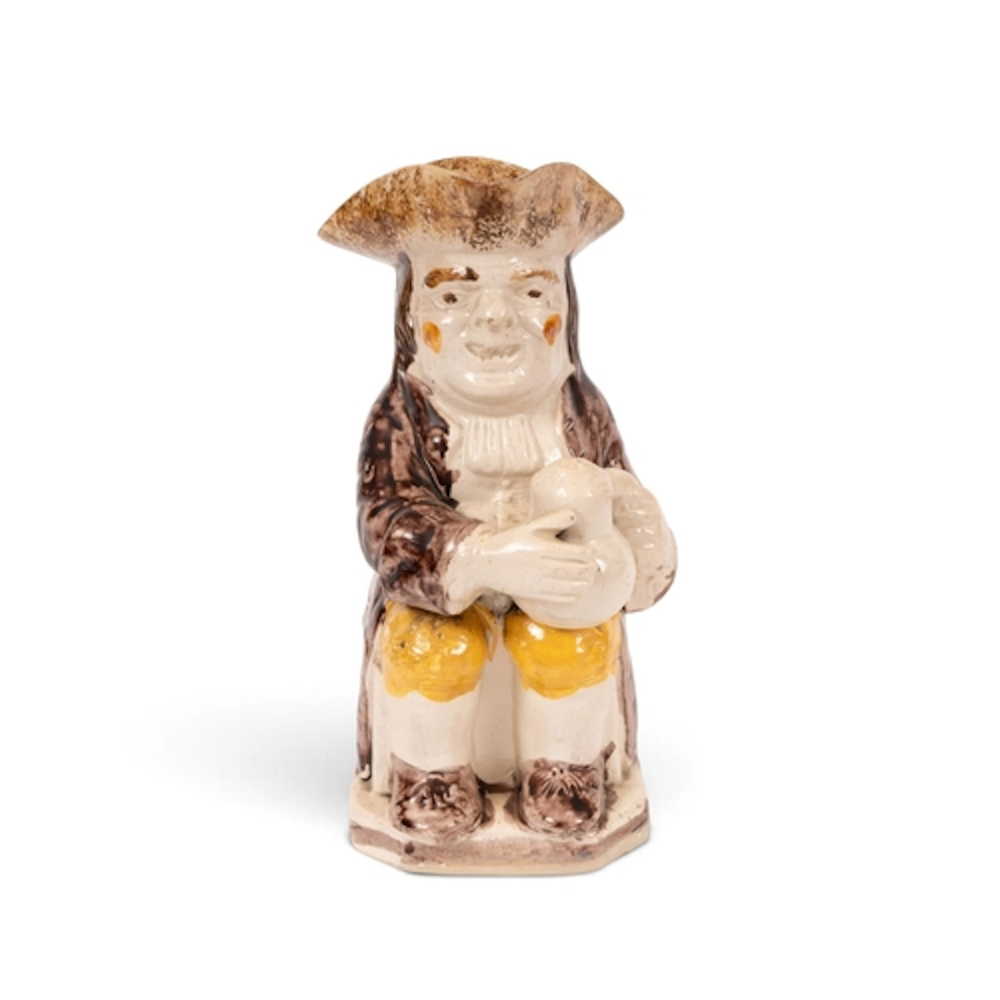 A creamware Toby jug, c.1790, seated with a foaming jug of a...