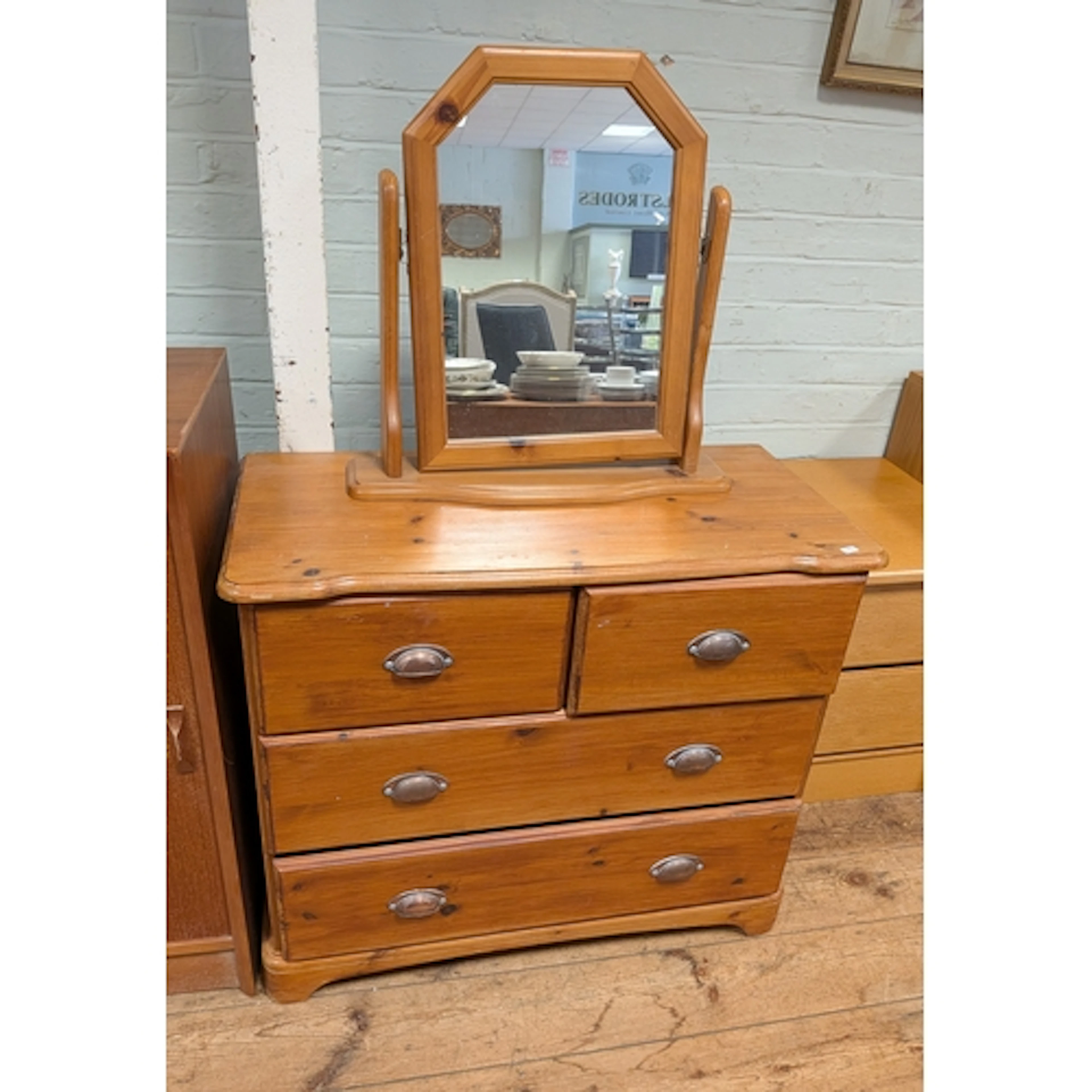 A small pine Victorian style chest of four drawers with free...