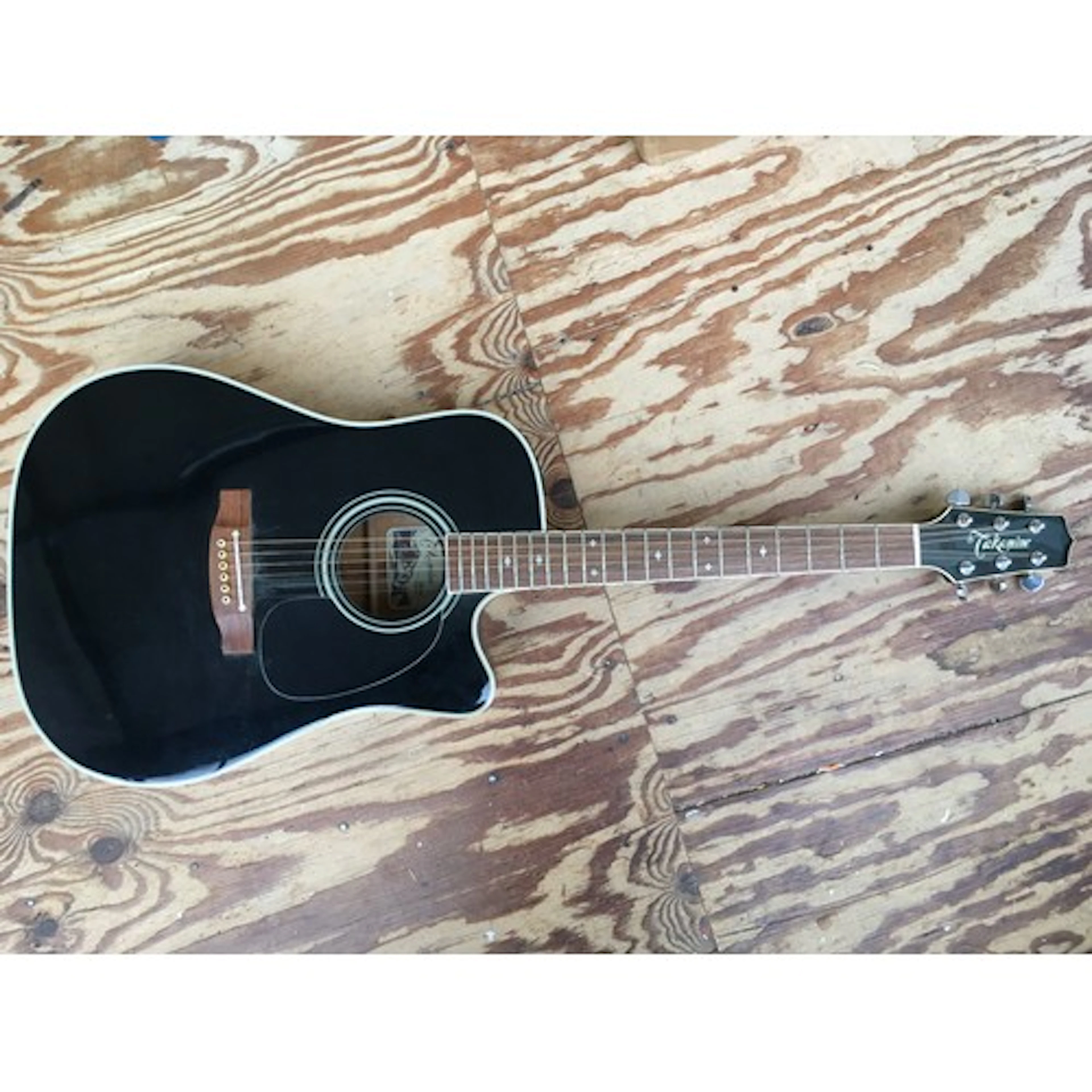 A Takamine EF341SC electro acoustic guitar with soft carry c...