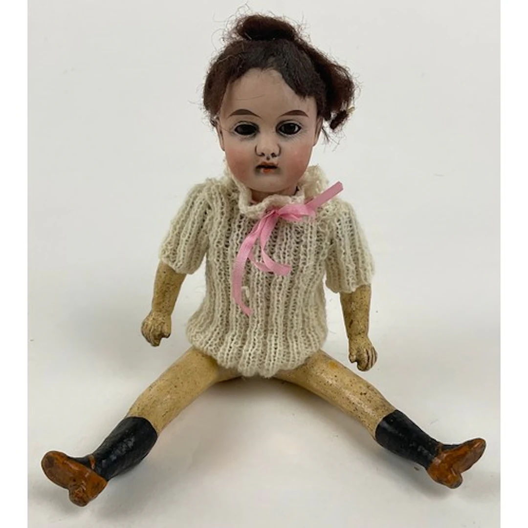 A small 19th century German bisque head doll marked ‘GK no.4...