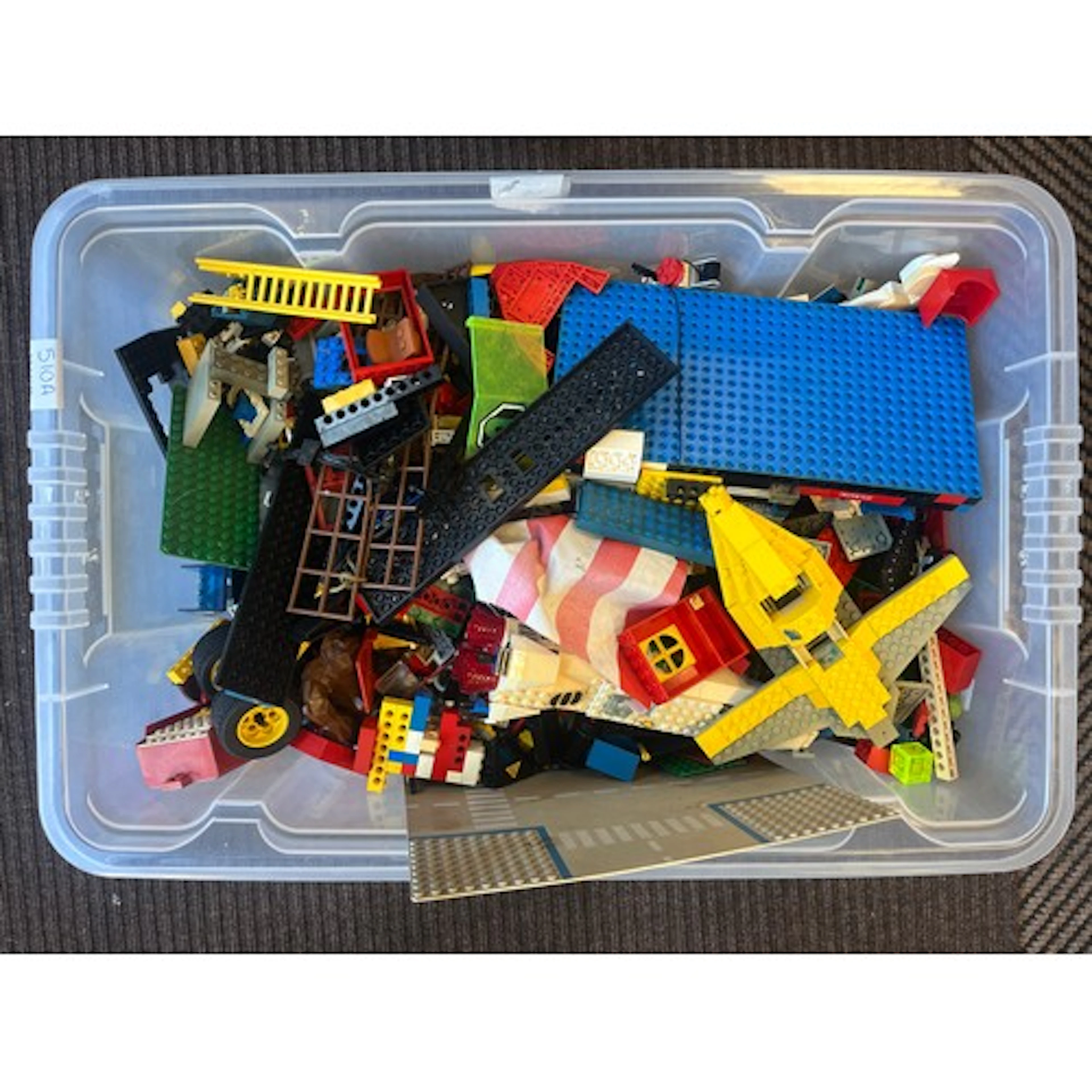 Box of assorted Lego pieces.