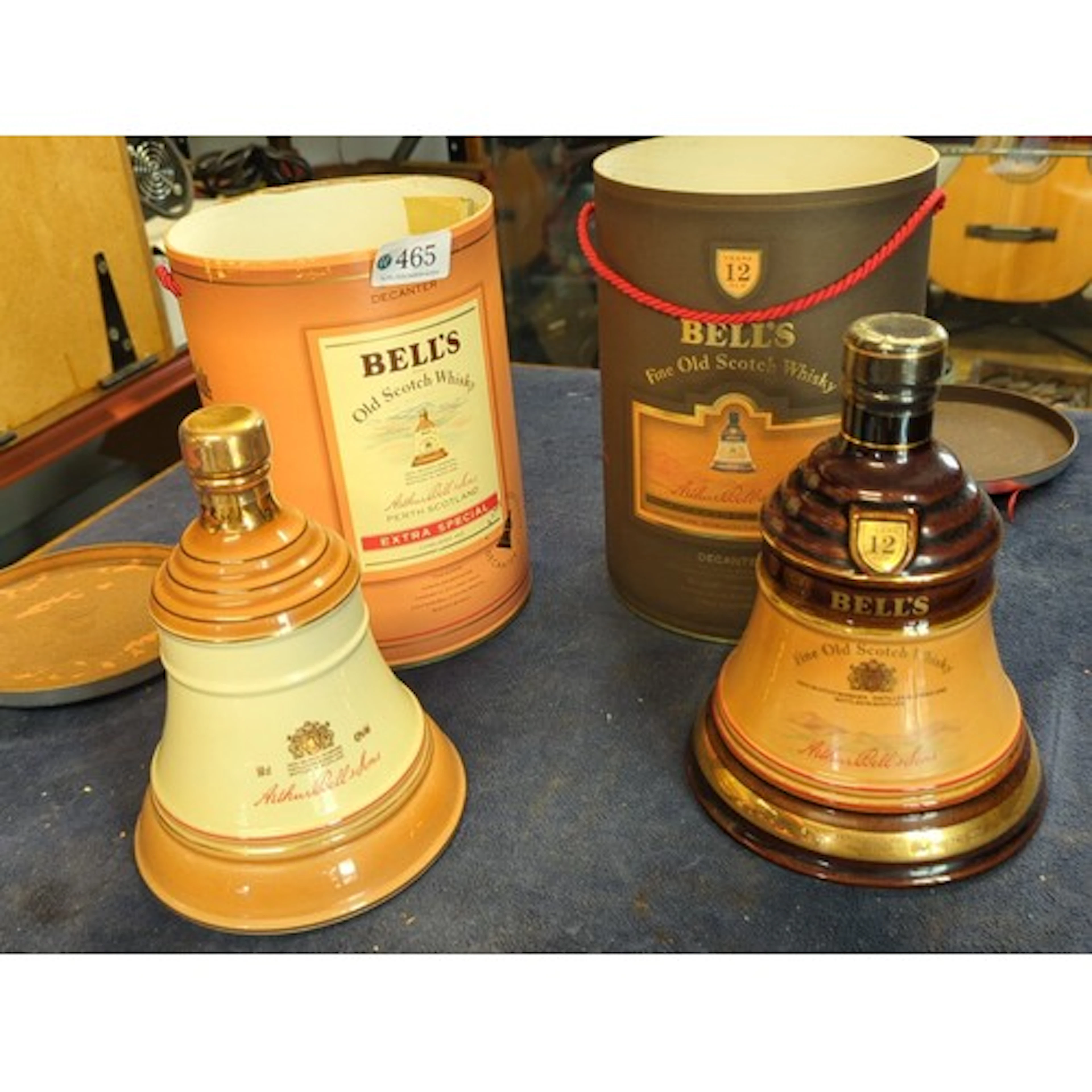 A pair of Bell’s Old Scotch Whisky ceramic bell-form decante...