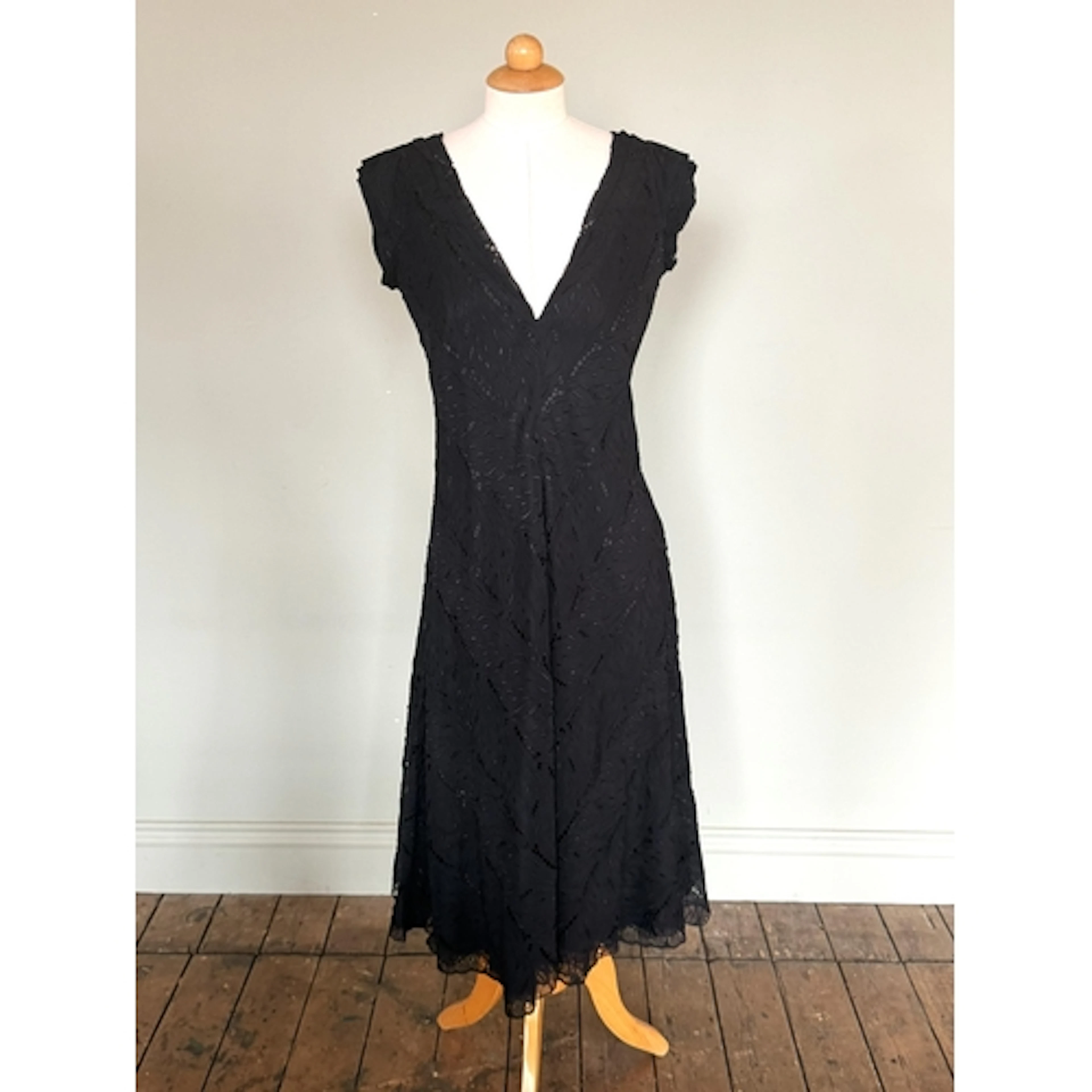 A Christian Lacroix black cocktail dress, with cut-out patte...