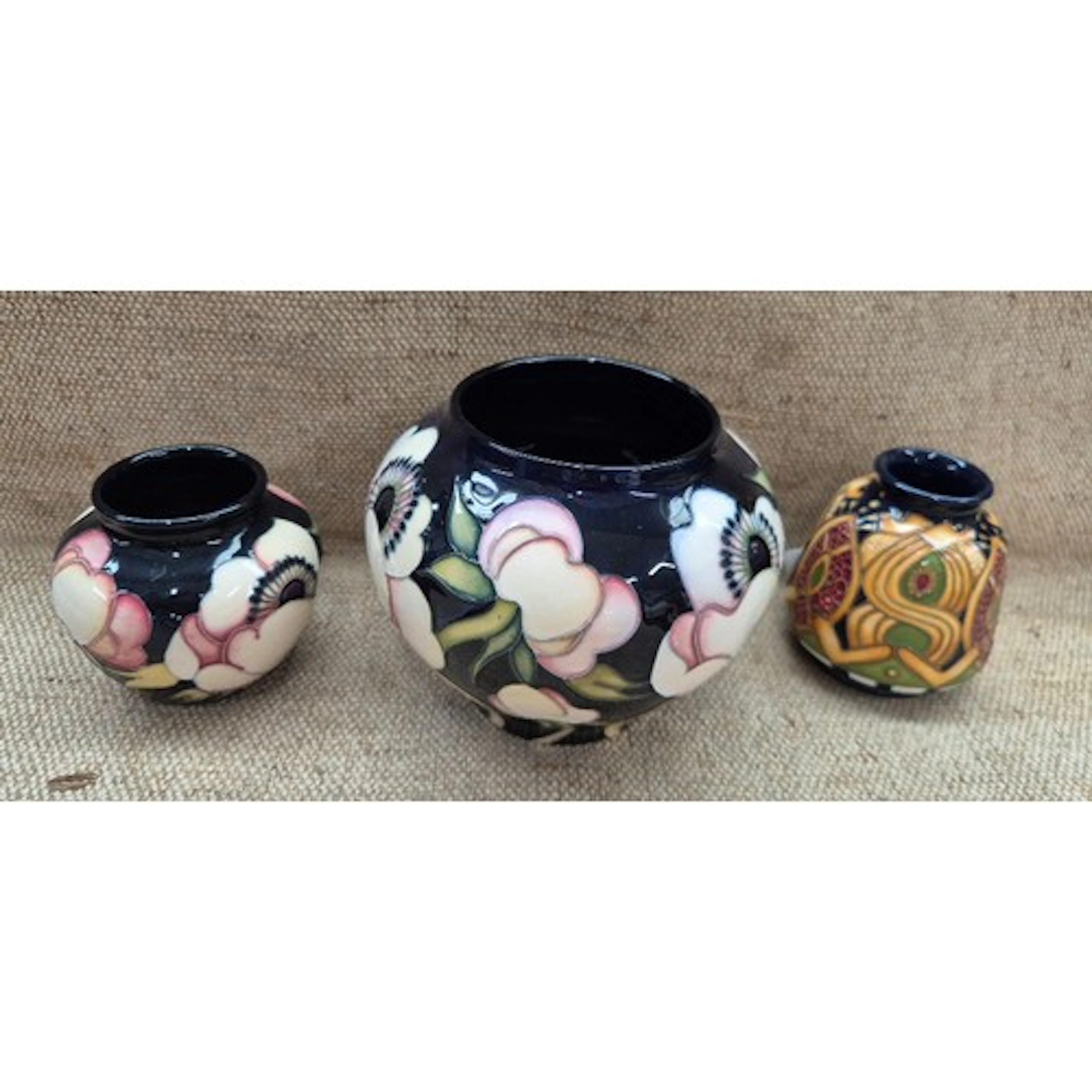 3 pieces of Moorcroft pottery. Squat vase with Staffordshire...