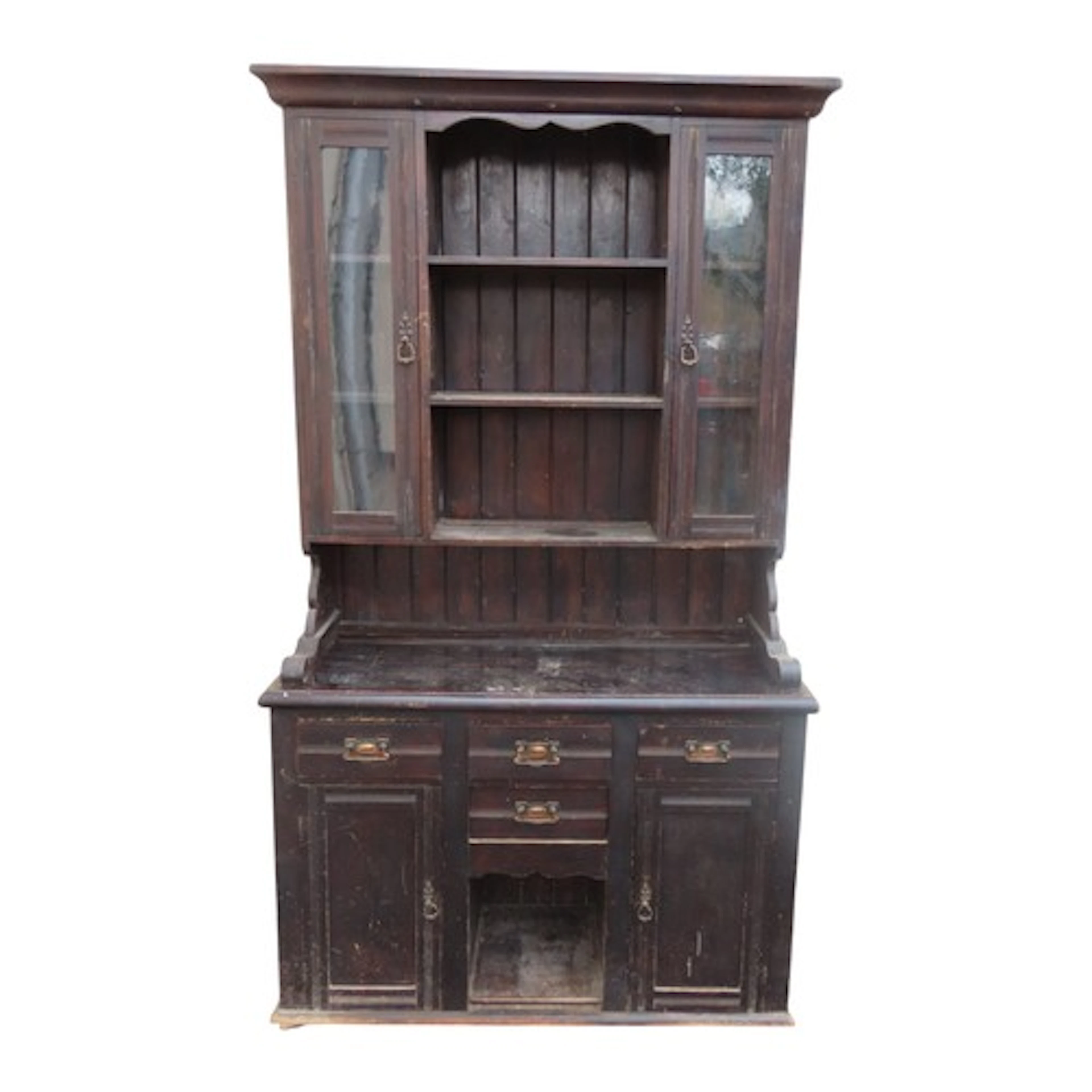 An Edwardian stained pine kitchen dresser enclosed by an arr...