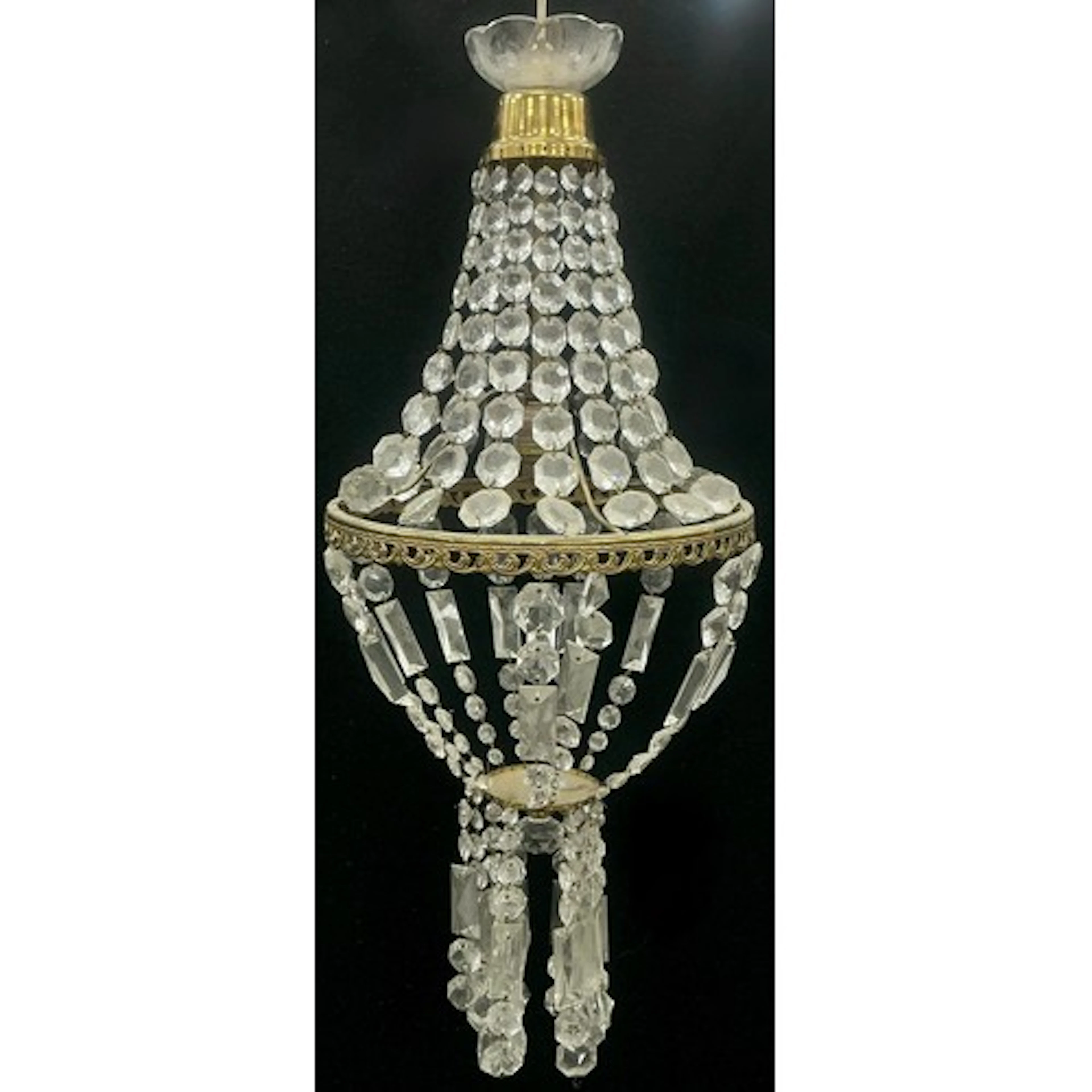 A 1920s French gilt metal and glass bead chandelier, gilt ri...