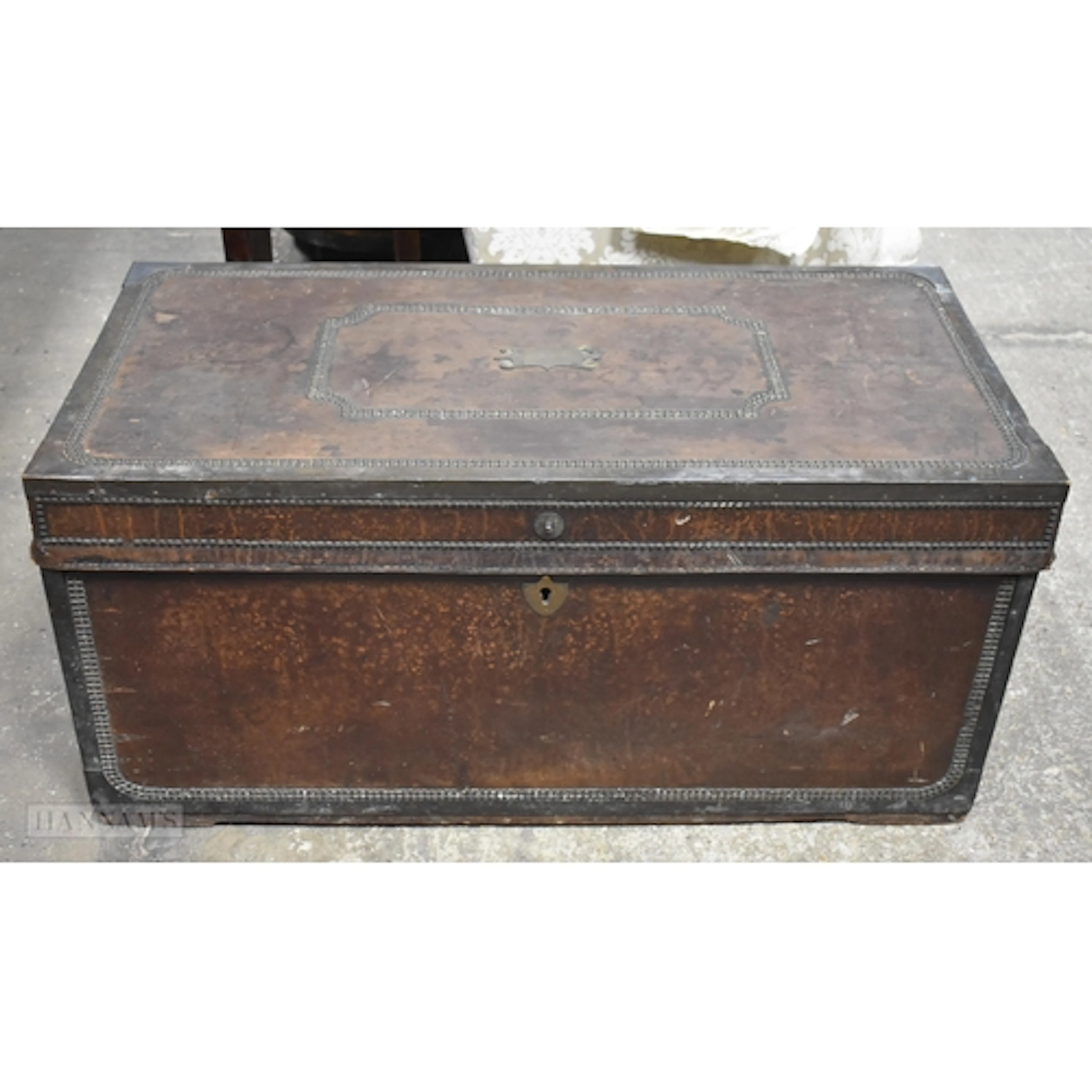 An antique Anglo Chinese leather covered Camphor wood brass...