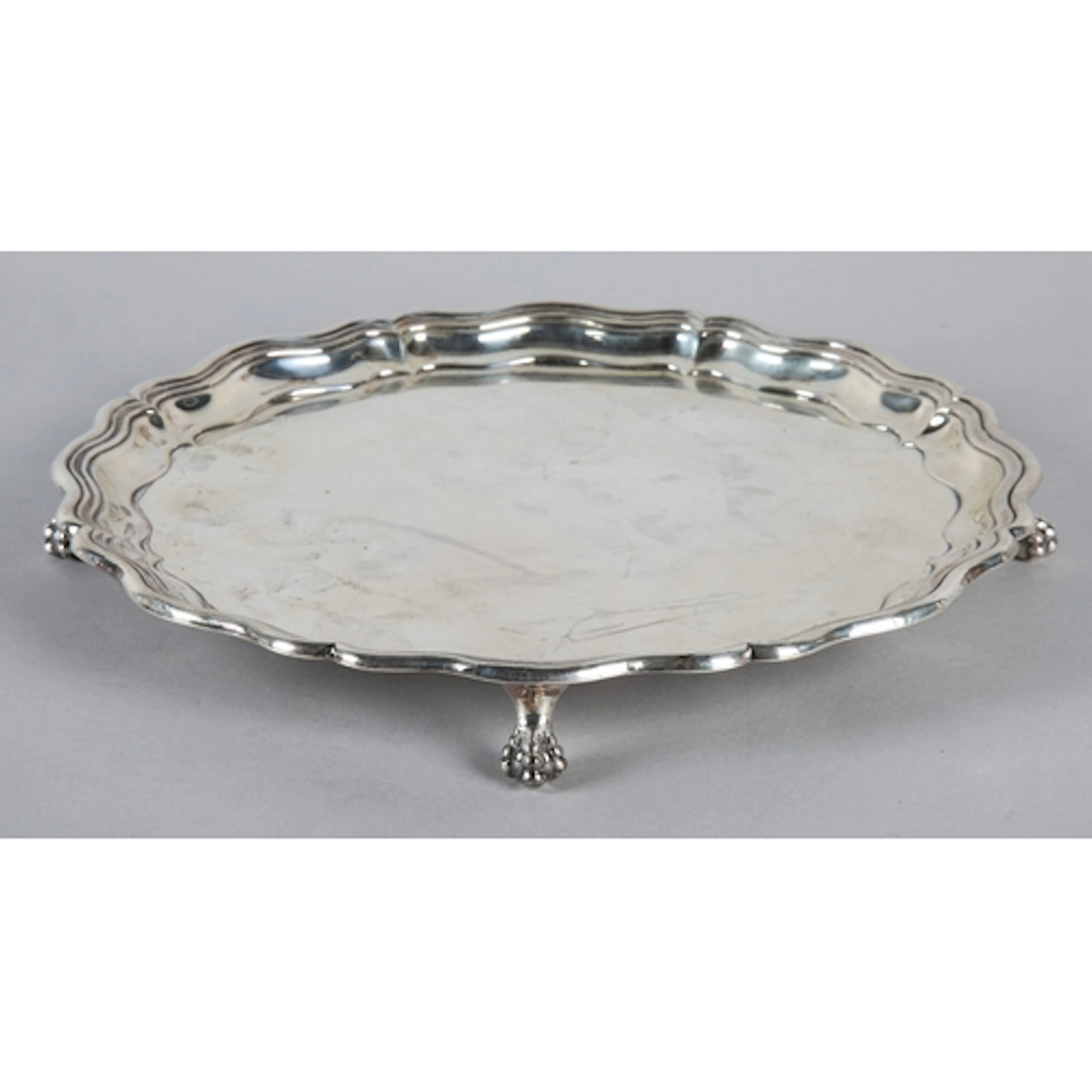 Edward VII silver waiter with wavy border on animal foot, Ol...