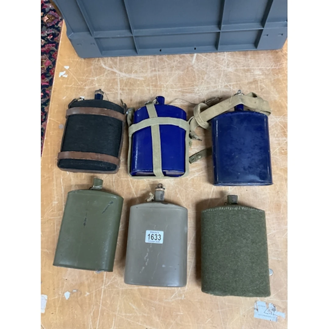 Six WWI water bottles.