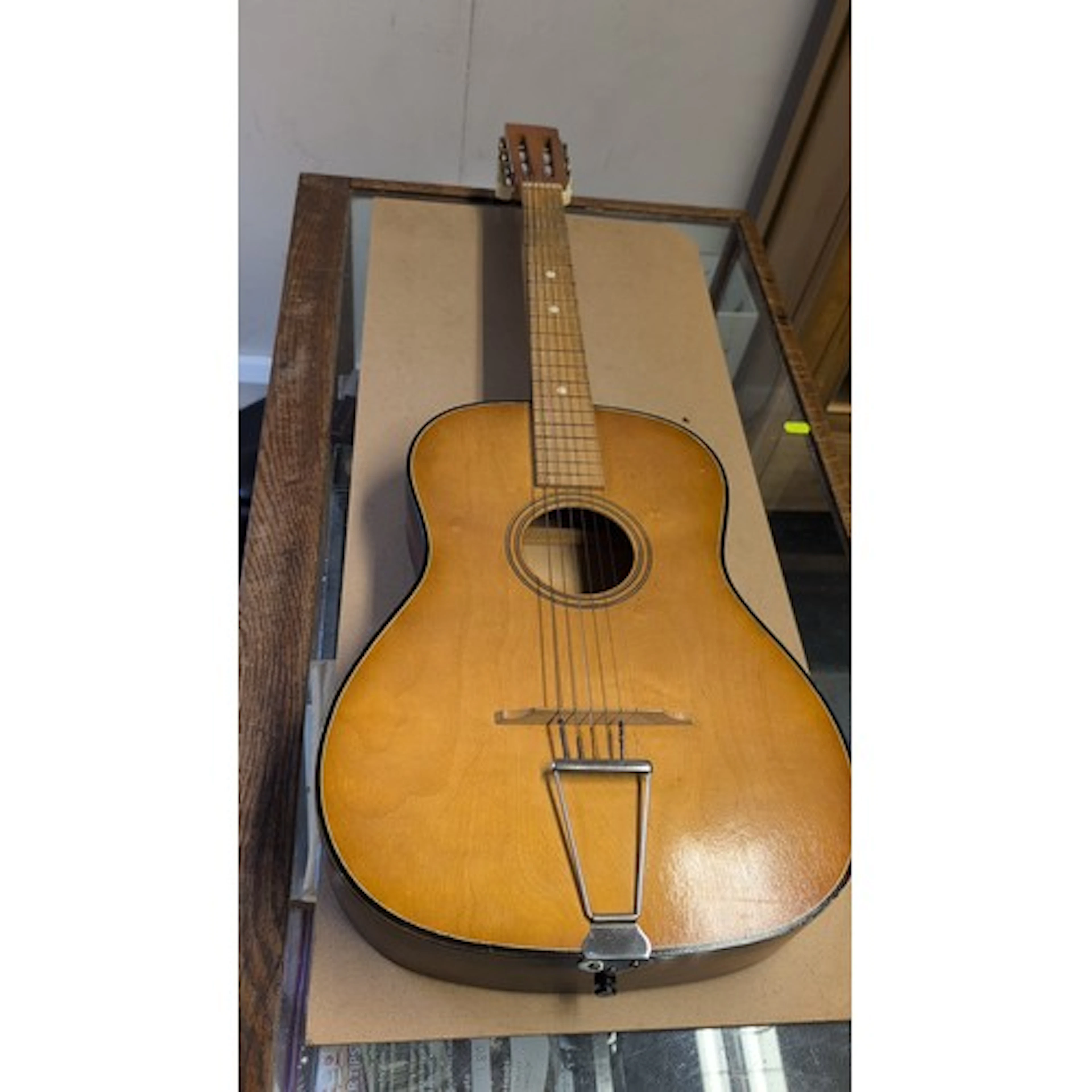 Classical acoustic guitar of small-bodied form, with natural...