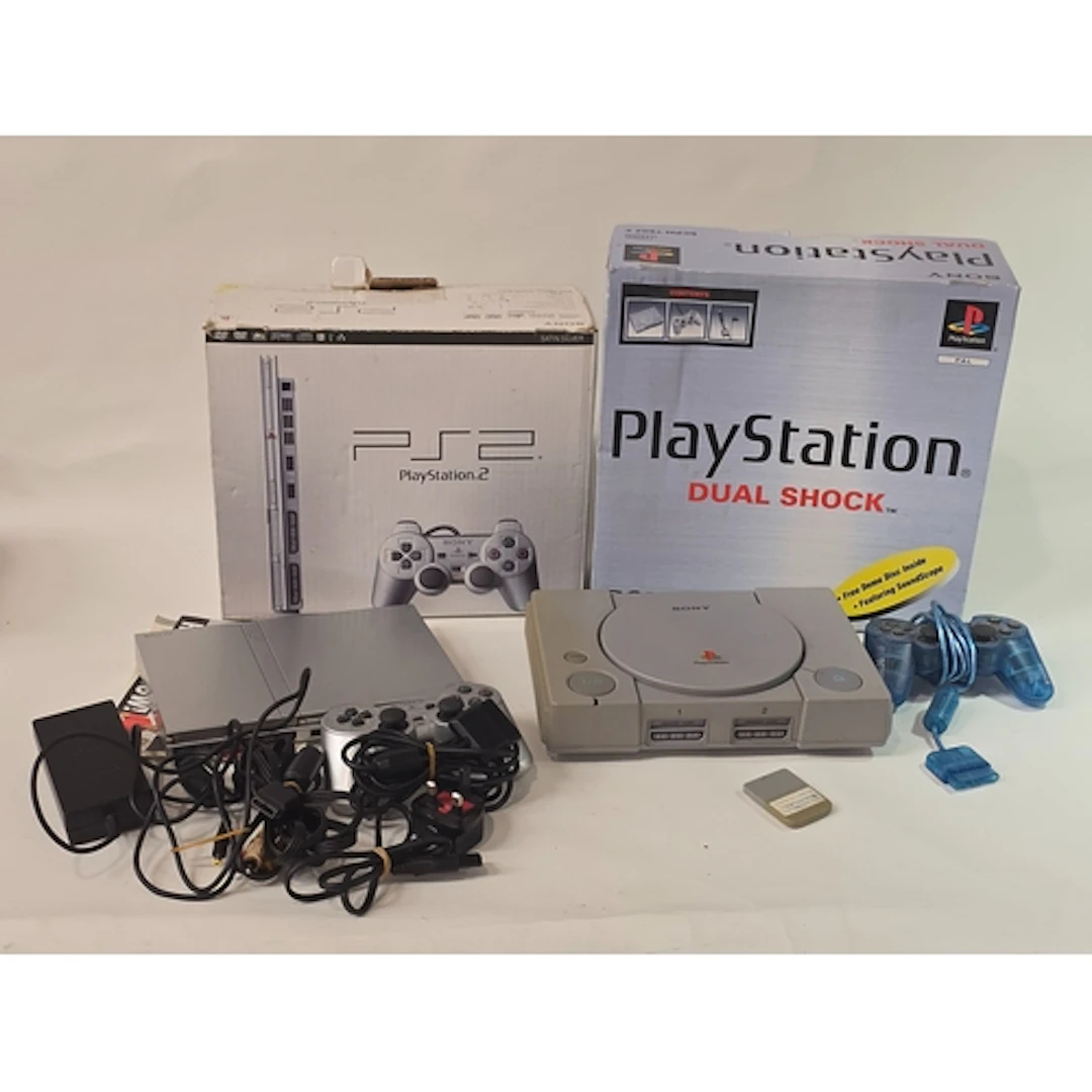 A vintage Sony PlayStation 1 PS1 dual shock console with con...