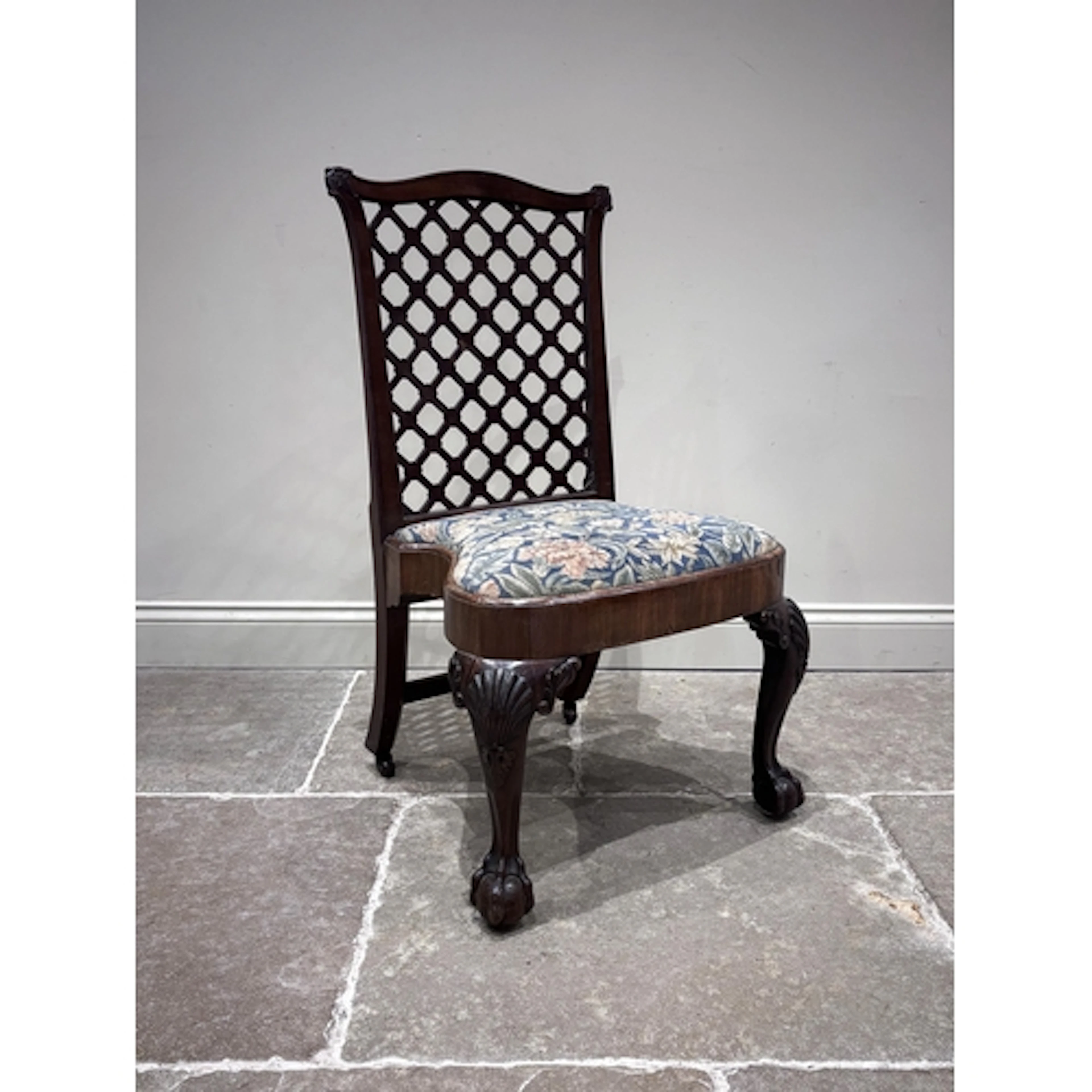 An 19th century mahogany lattice back chair, in the manner o...