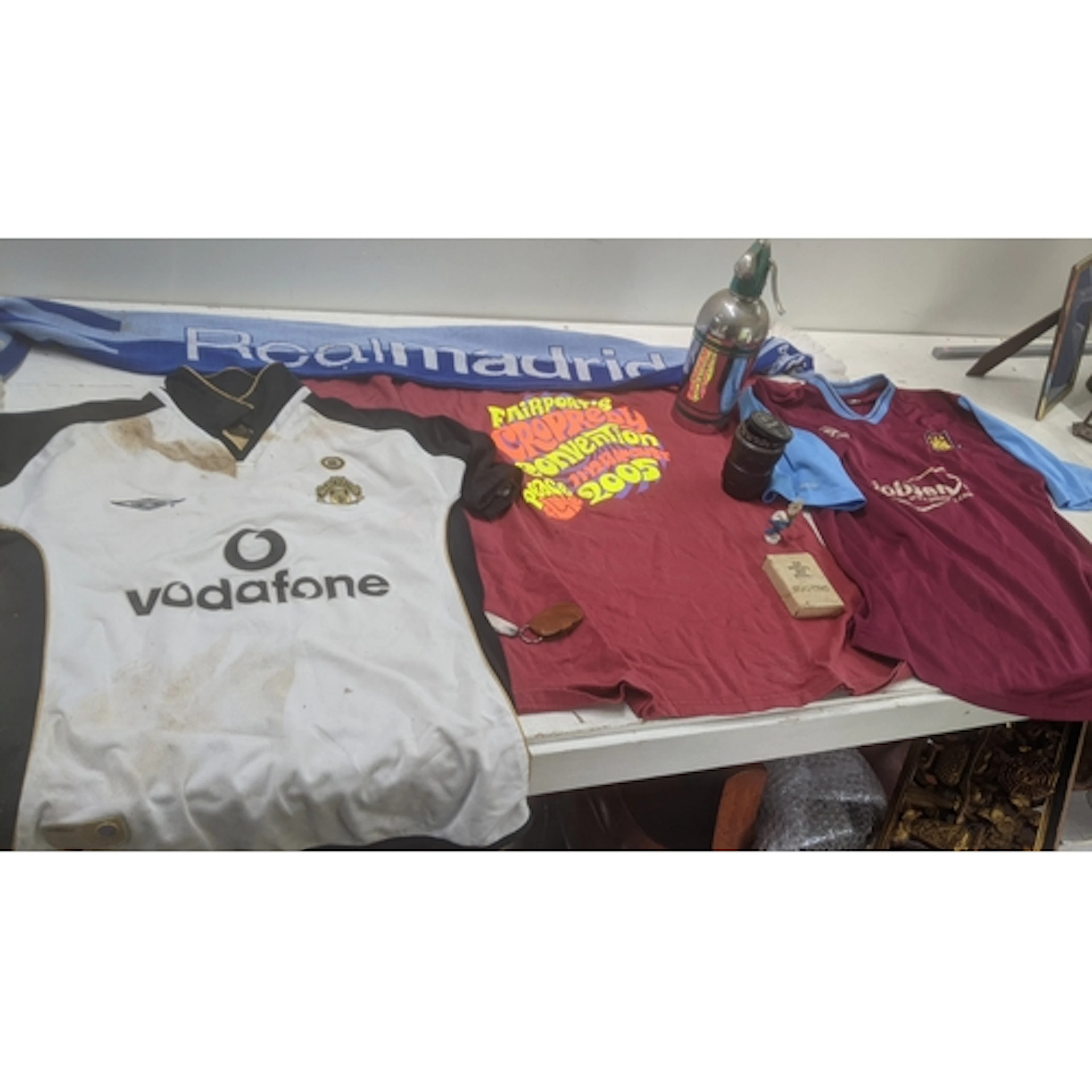 A mixed lot to include a retro 2000's Westham United shirt, ...