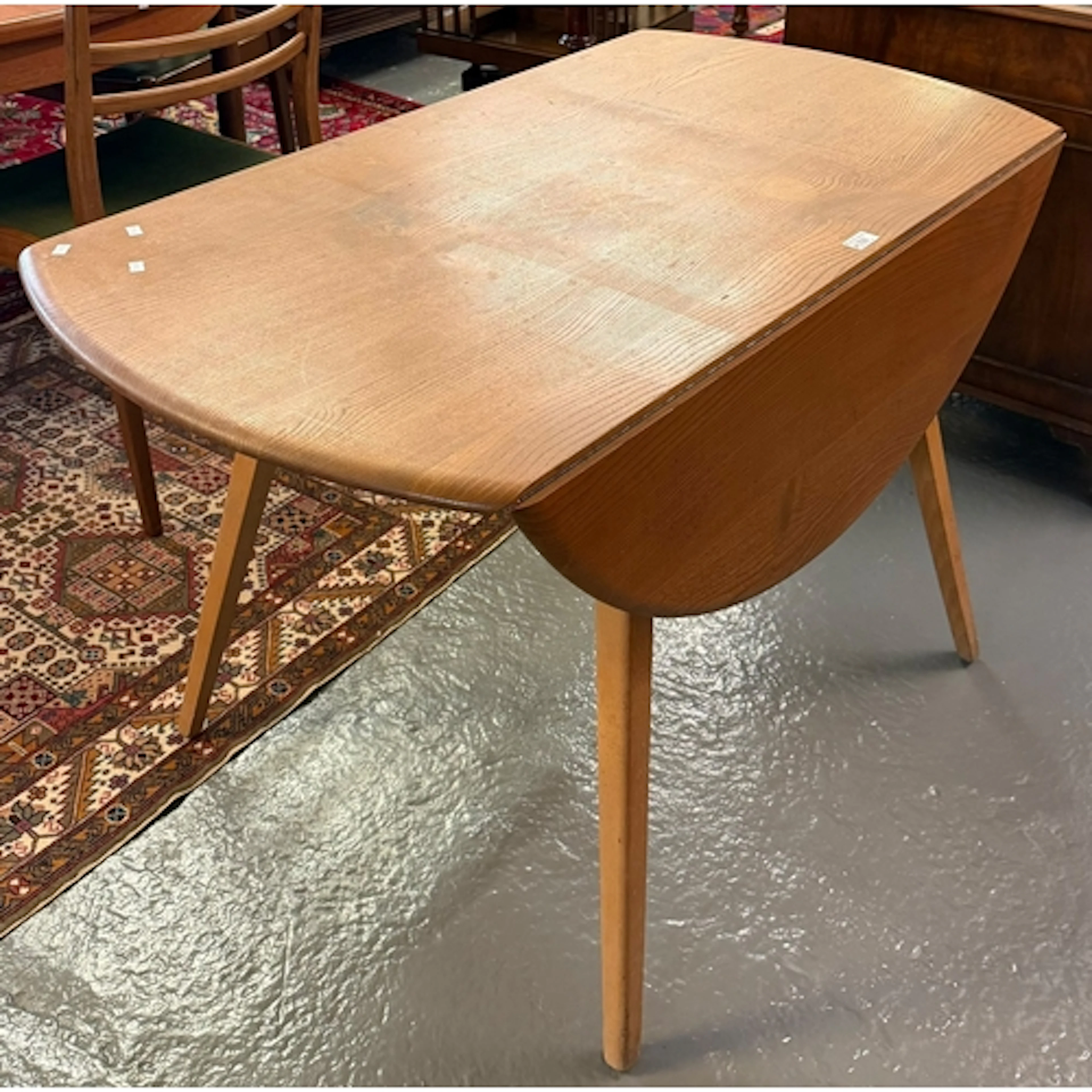 Ercol elm oval drop leaf dining table on square tapering leg...
