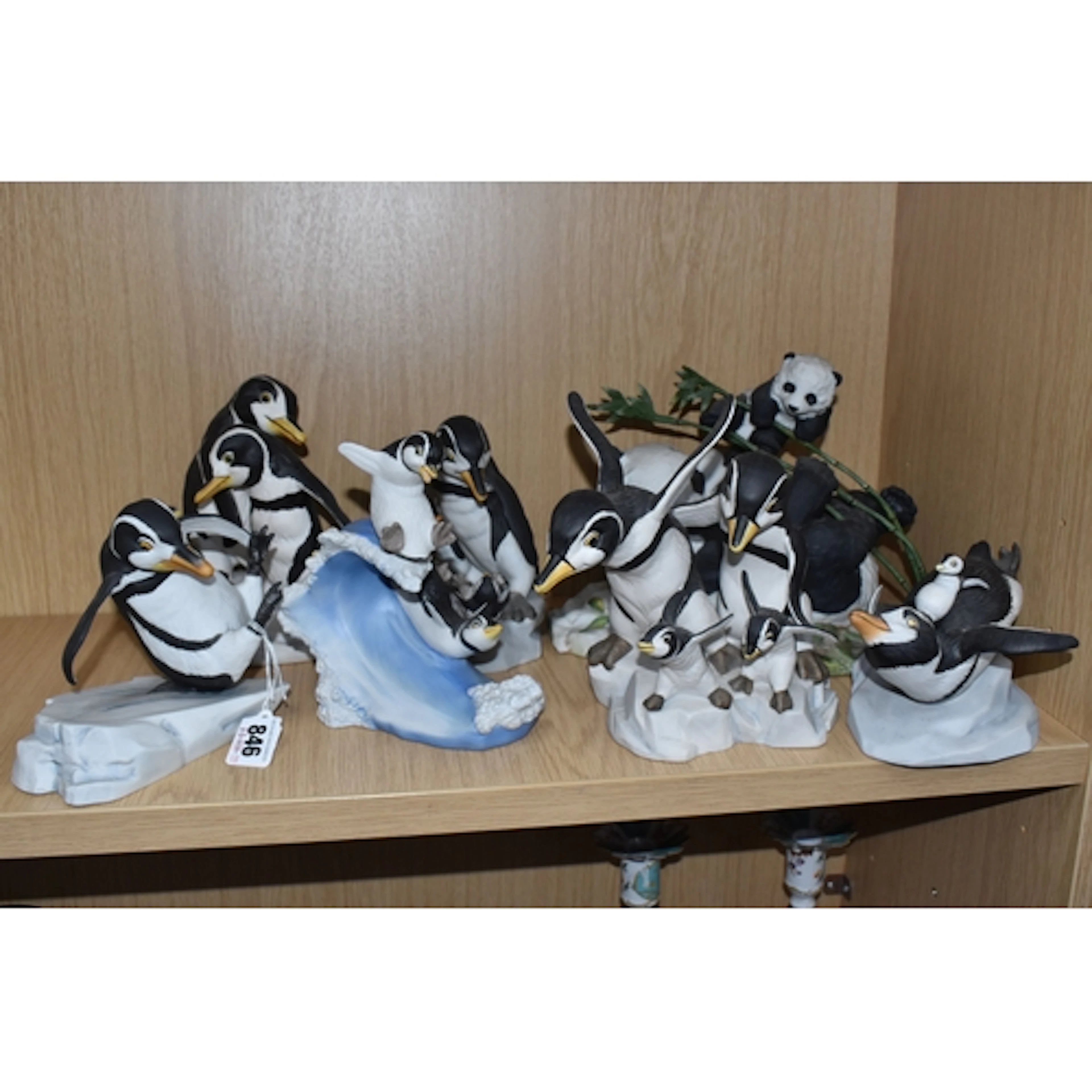 SEVEN FRANKLIN MINT PORCELAIN FIGURES OF PENGUINS AND A PAND...