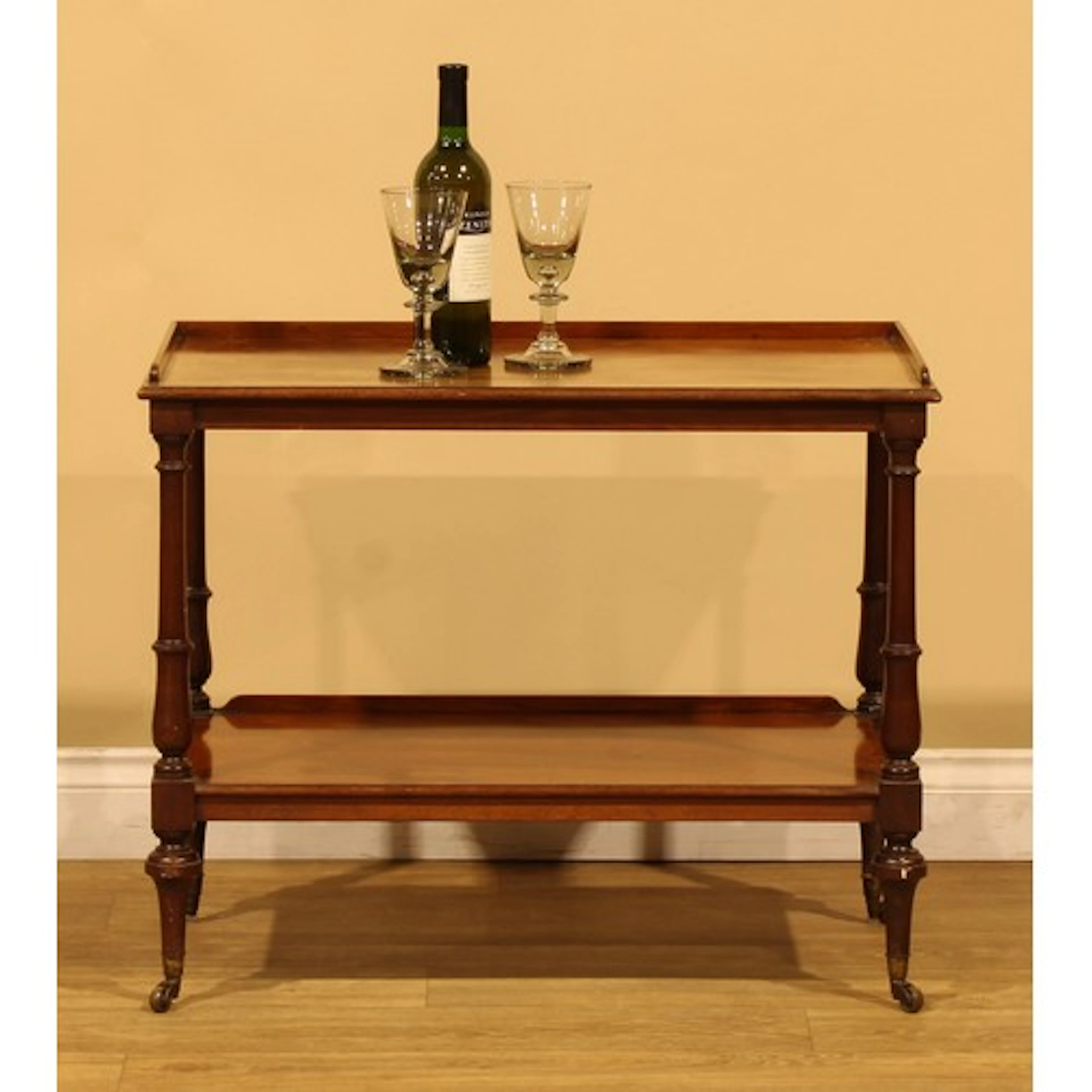 A late Victorian mahogany two-tier buffet sofa table or etag...