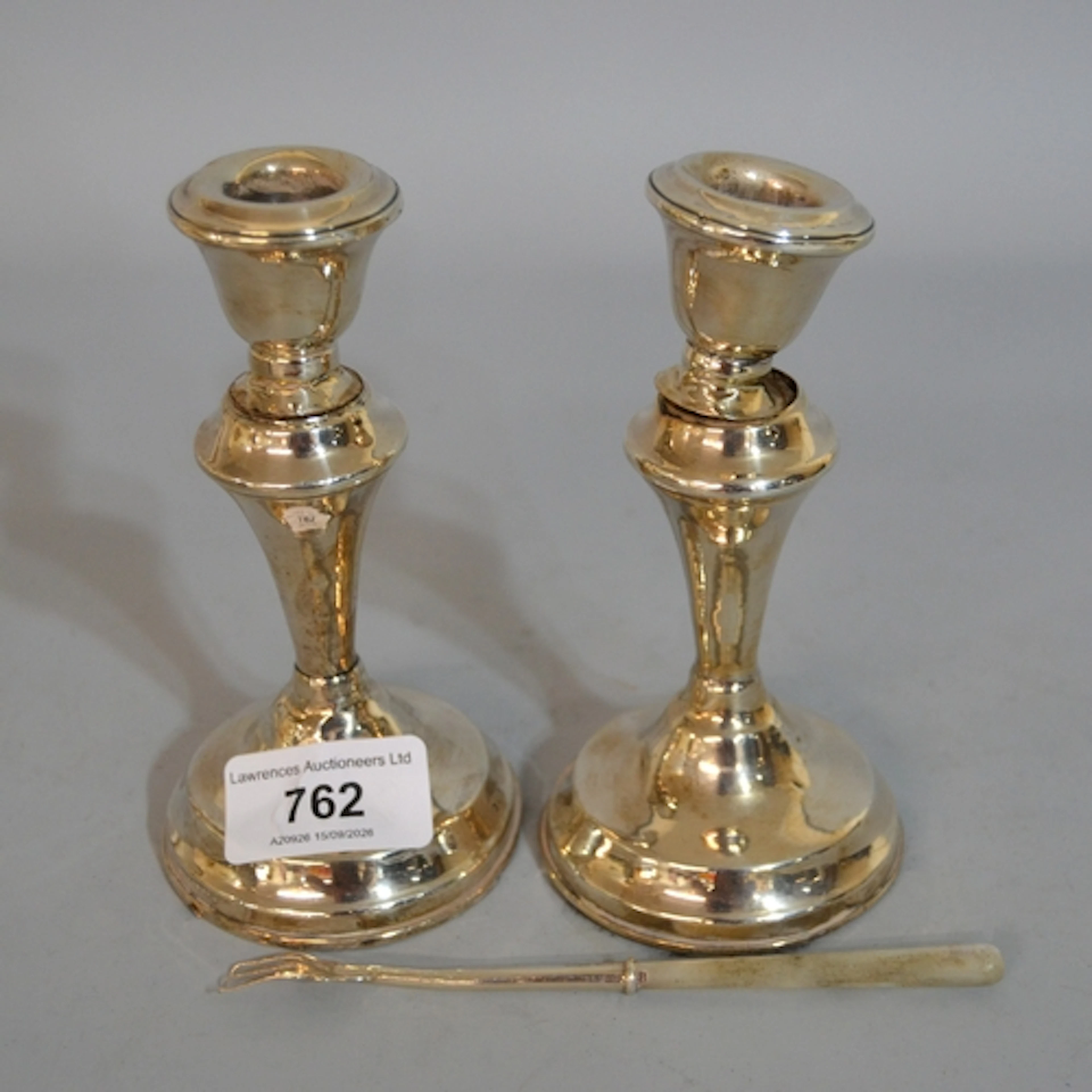 Pair of Birmingham silver dwarf candlesticks (at fault), wei...