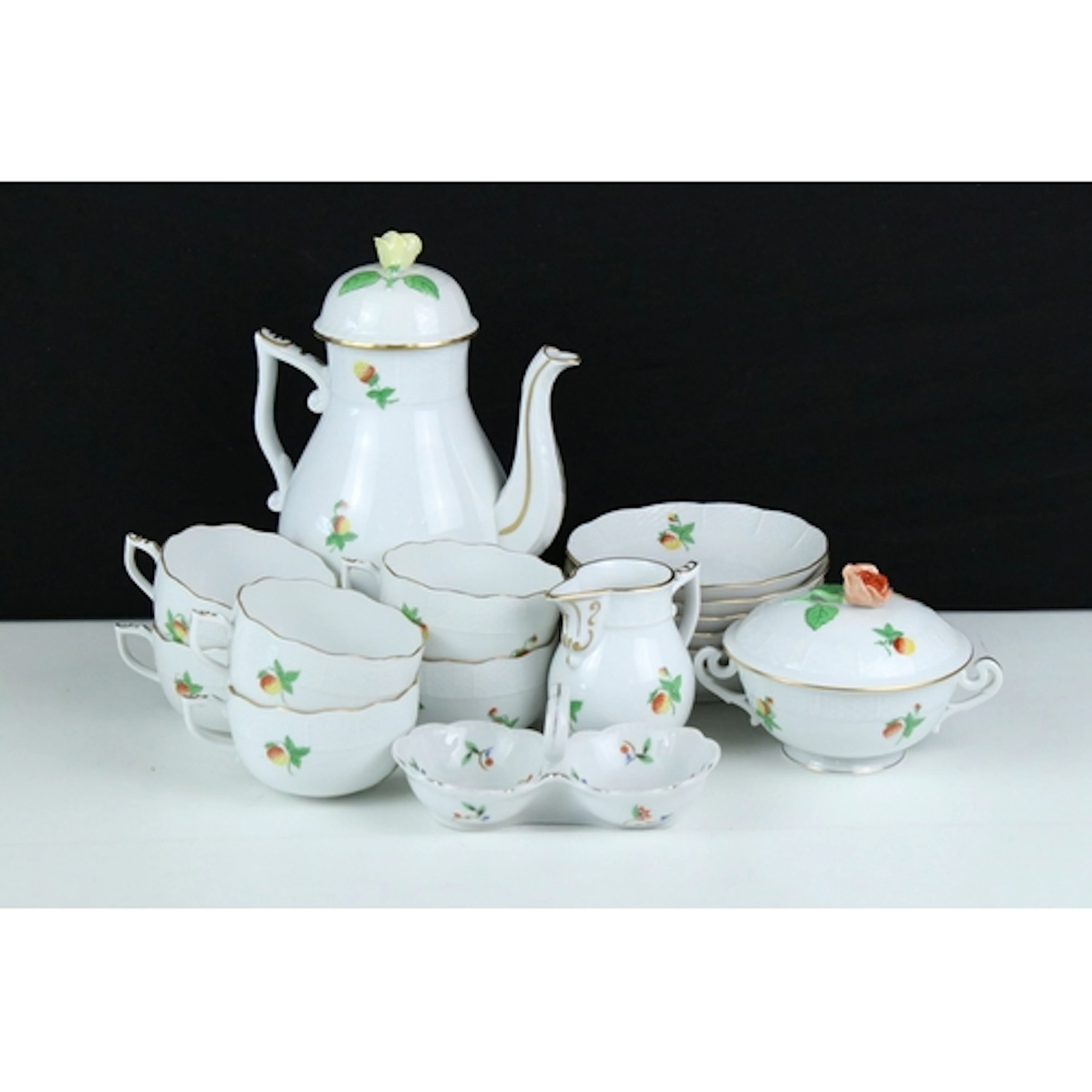 Herend part tea set with strawberry decoration and moulded b...