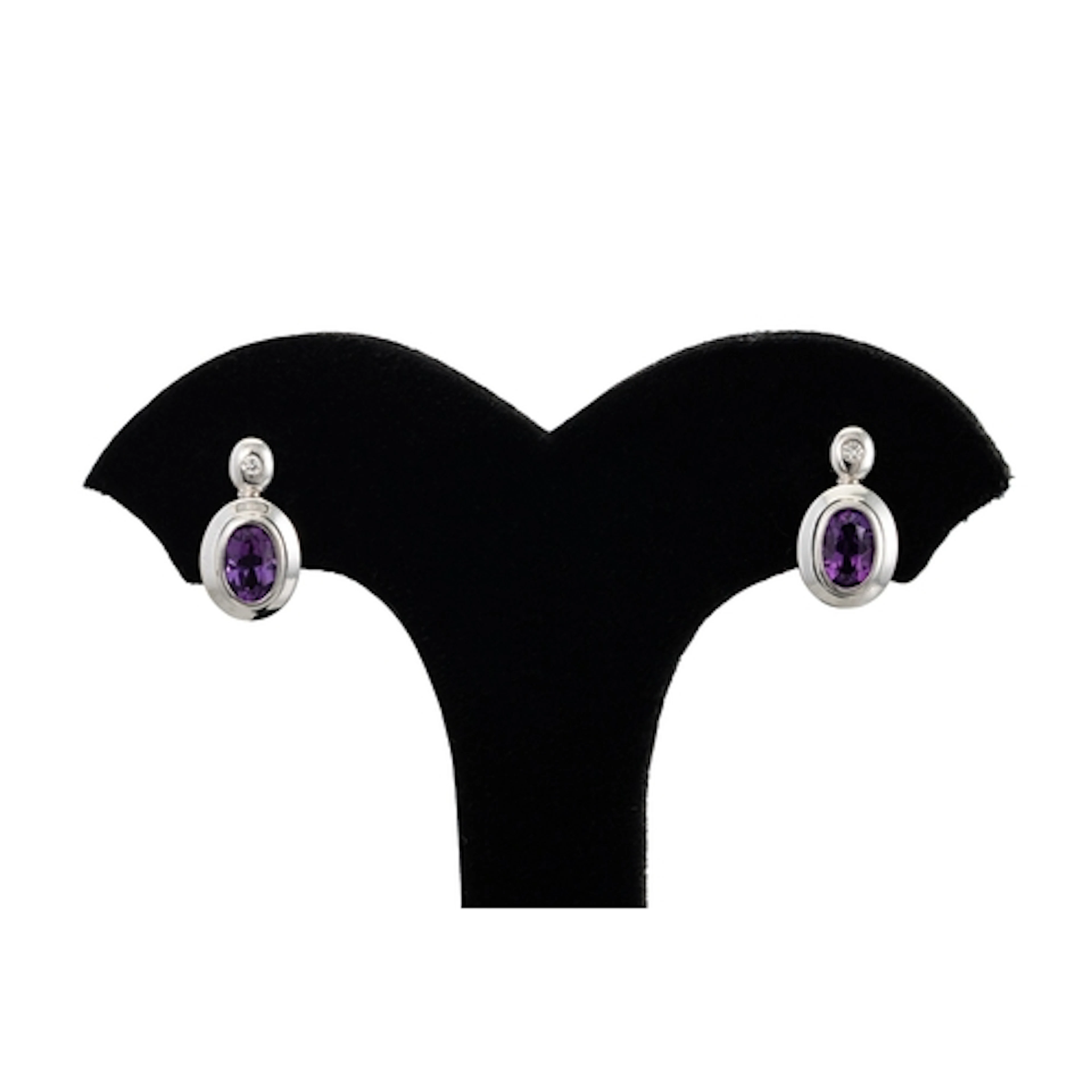 A PAIR OF DIAMOND AND AMETHYST EARRINGS, the bezel set dimao...