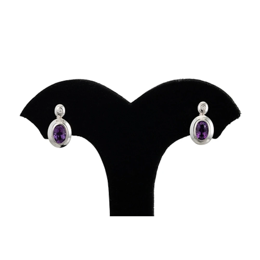A PAIR OF DIAMOND AND AMETHYST EARRINGS, the bezel set dimao...