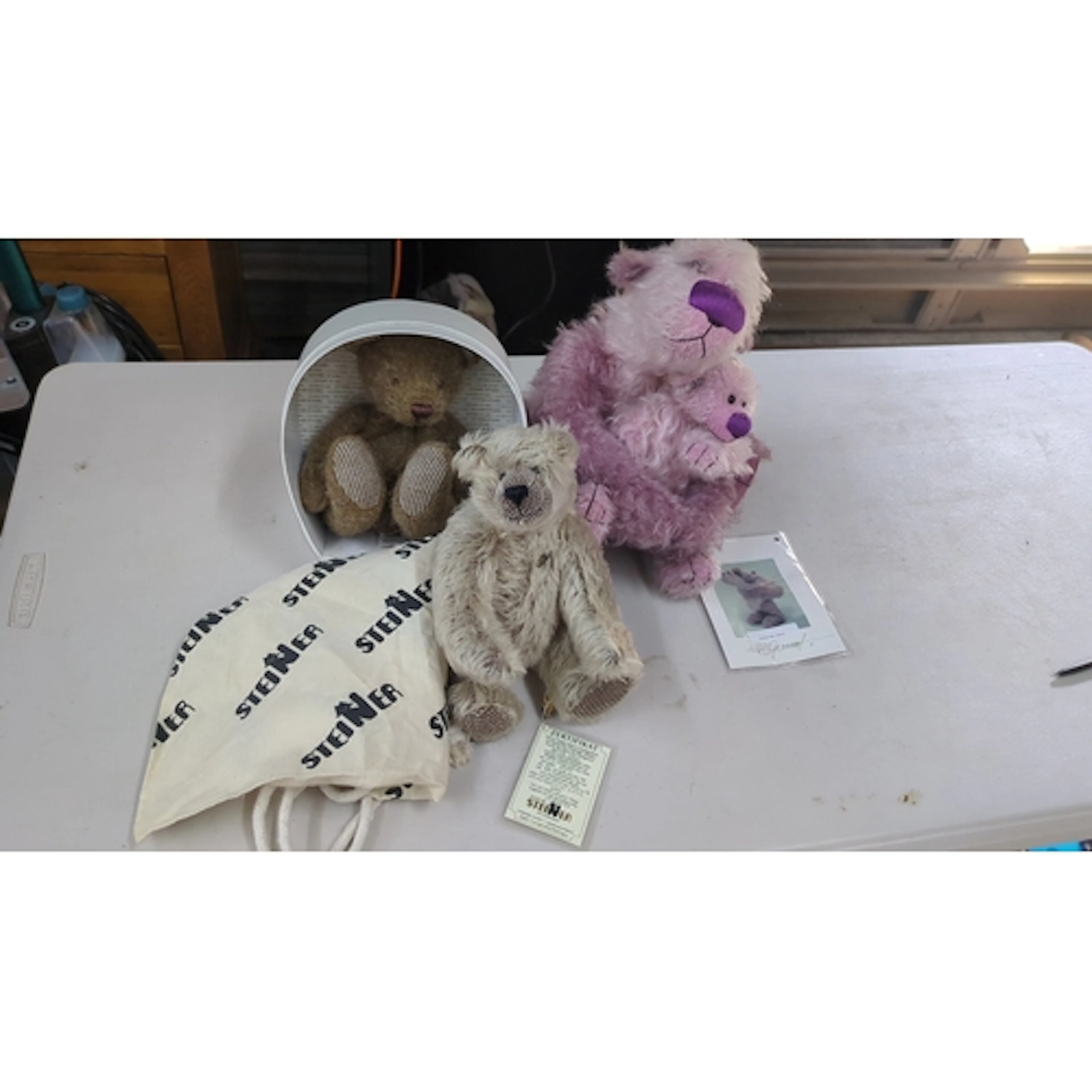 A group of contemporary collectible teddy bears, including a...