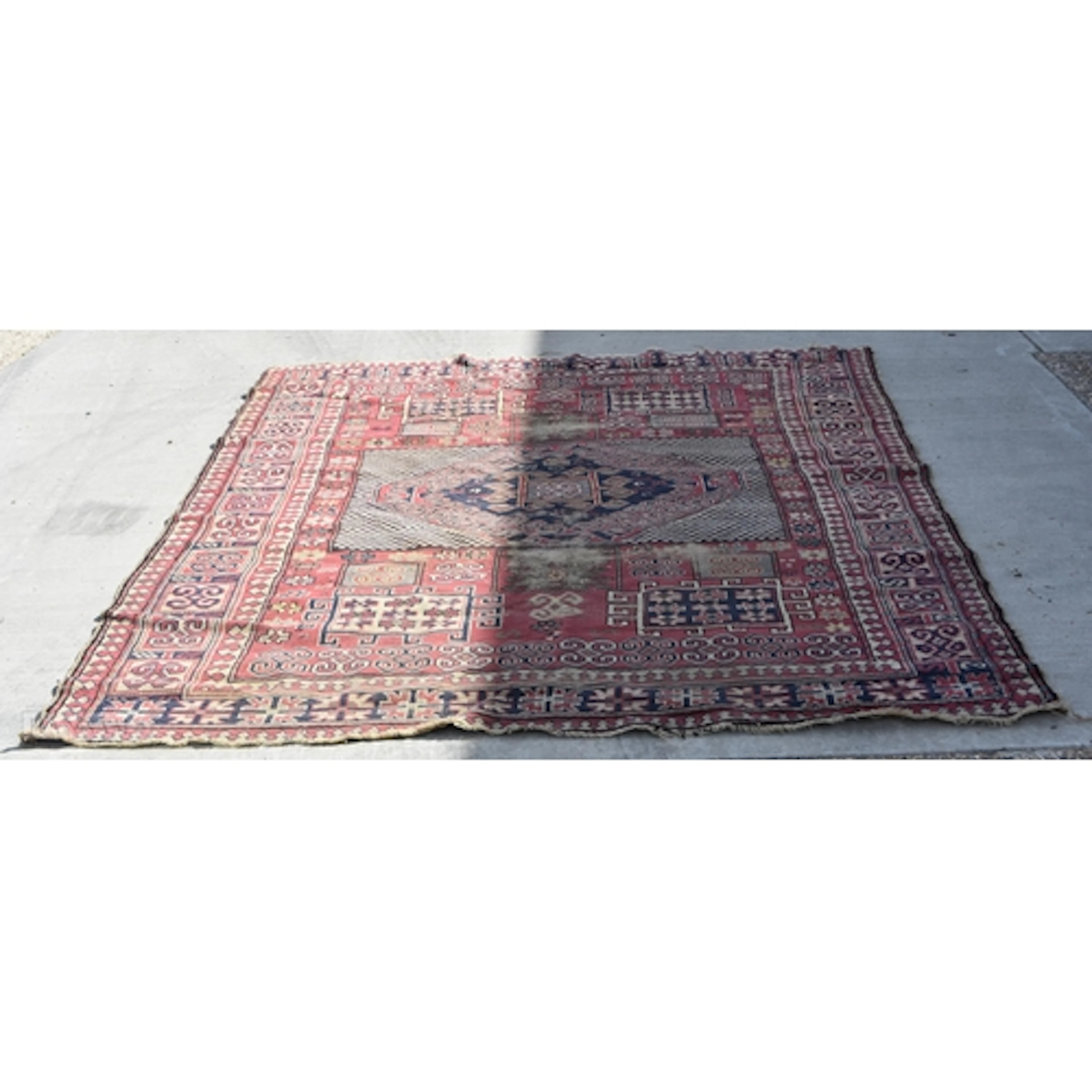 A large Caucasian rug 186 x 236cm