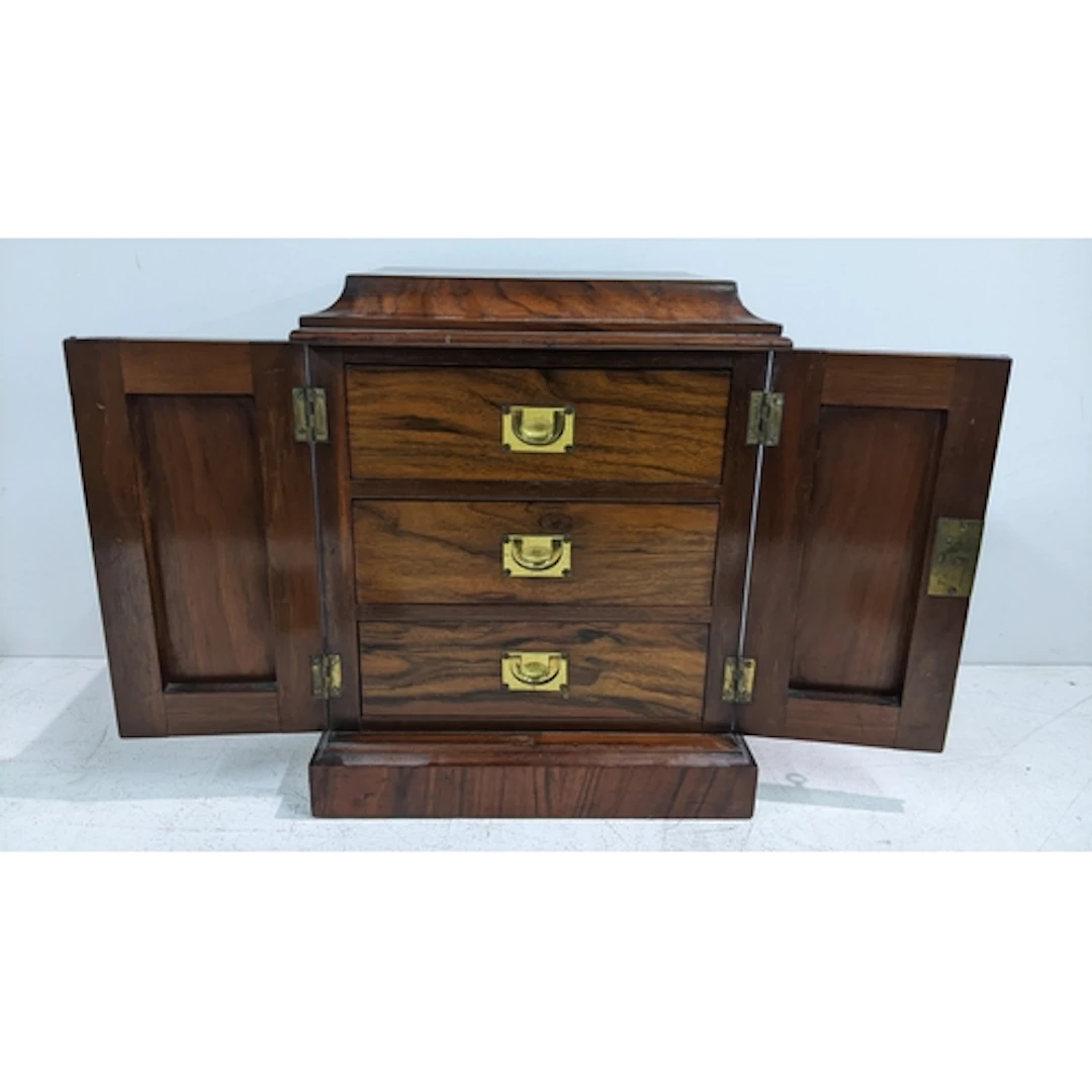A Victorian walnut desk top collectors cabinet having twin d...