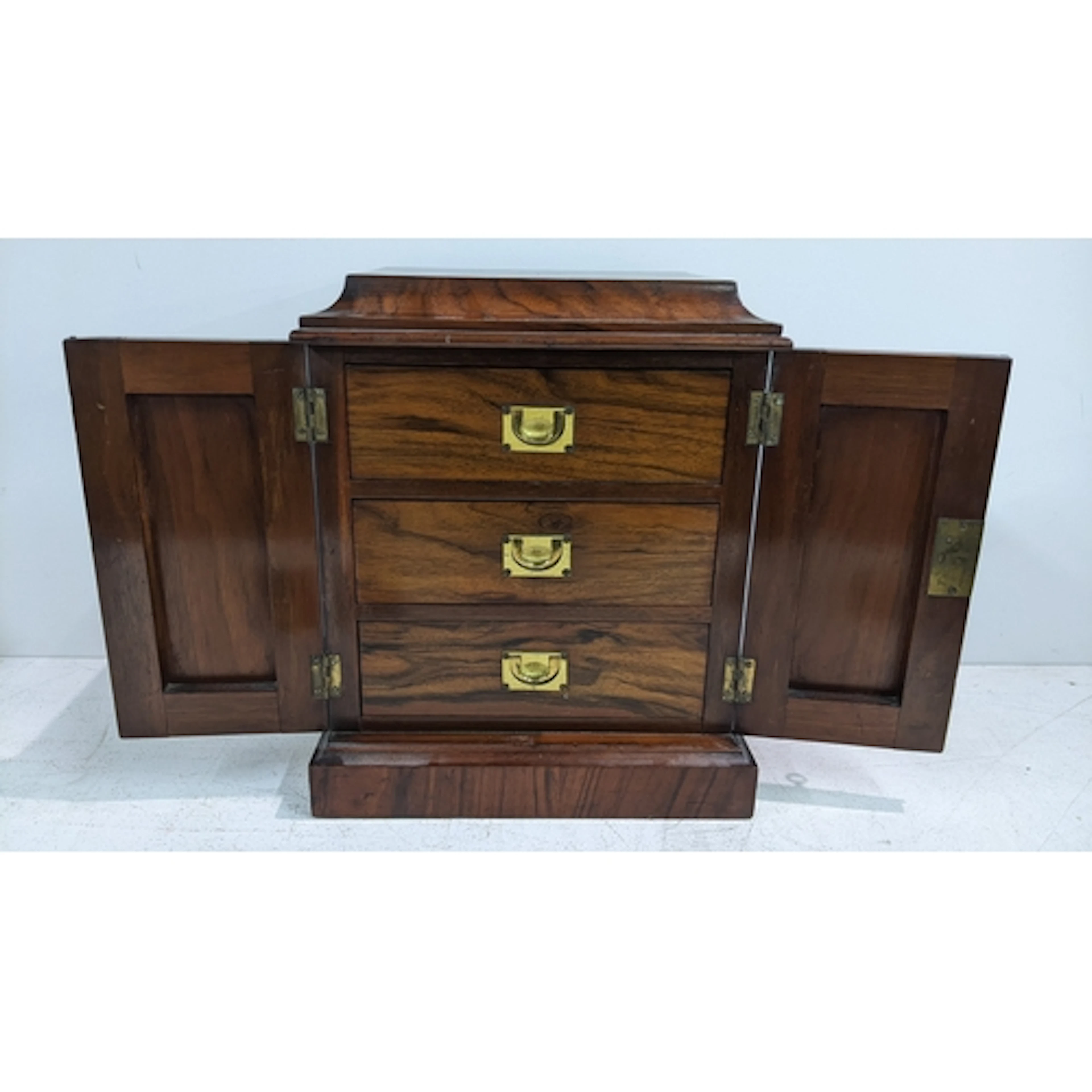 A Victorian walnut desk top collectors cabinet having twin d...