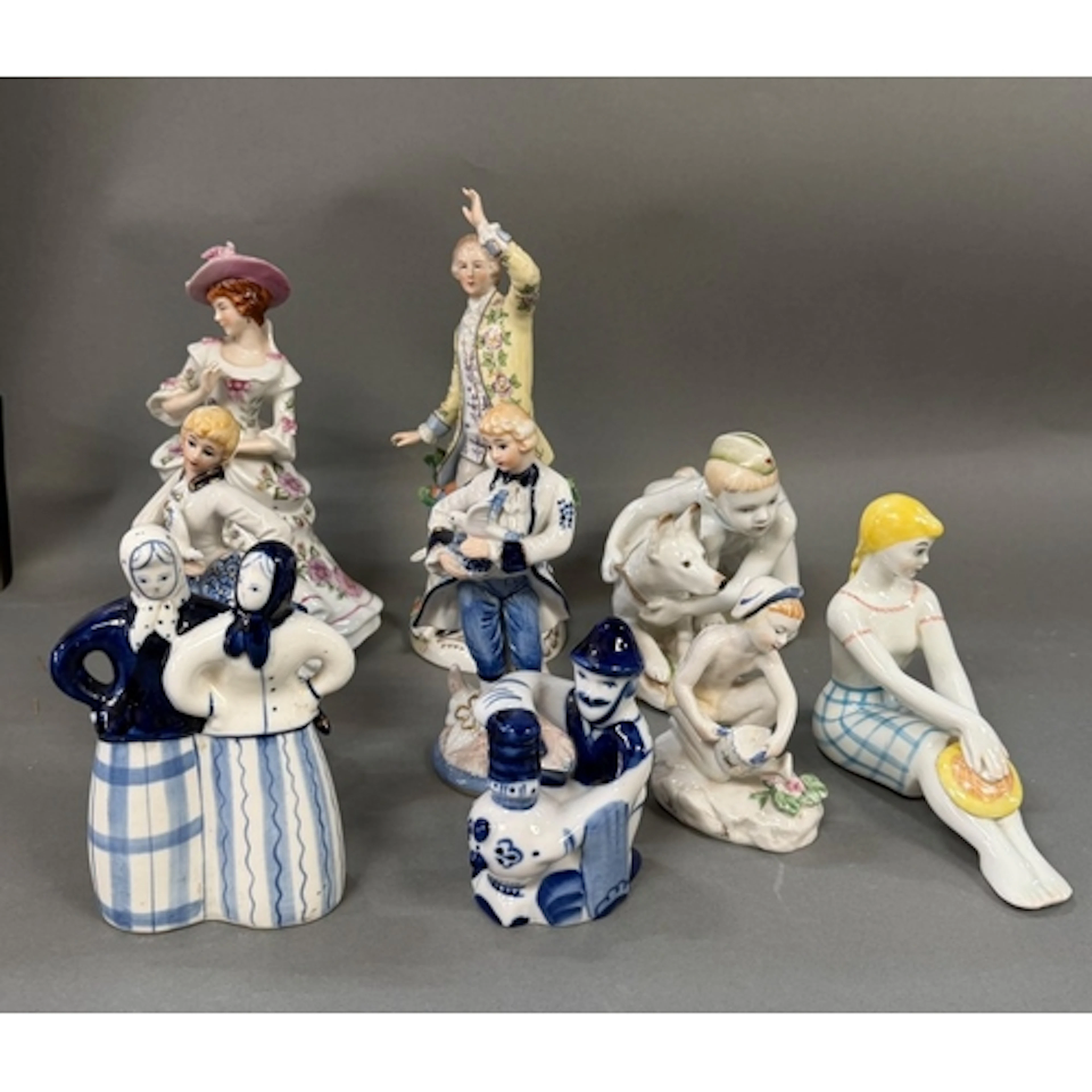 A selection of porcelain figurines made and stamped in USSR...