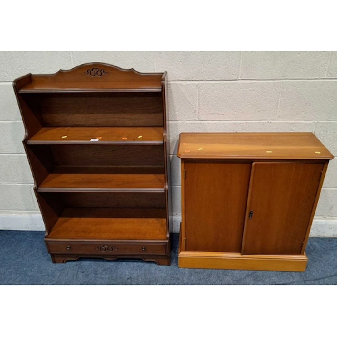 A REPRODUCTION WATERFALL OPEN BOOKCASE, with a single drawer...