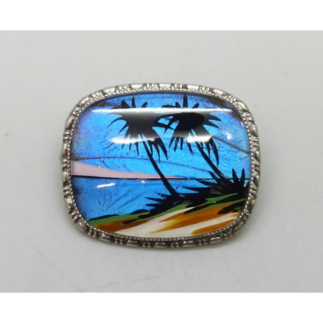 Thomas Mott, an Art Deco silver and butterfly wing brooch wi...