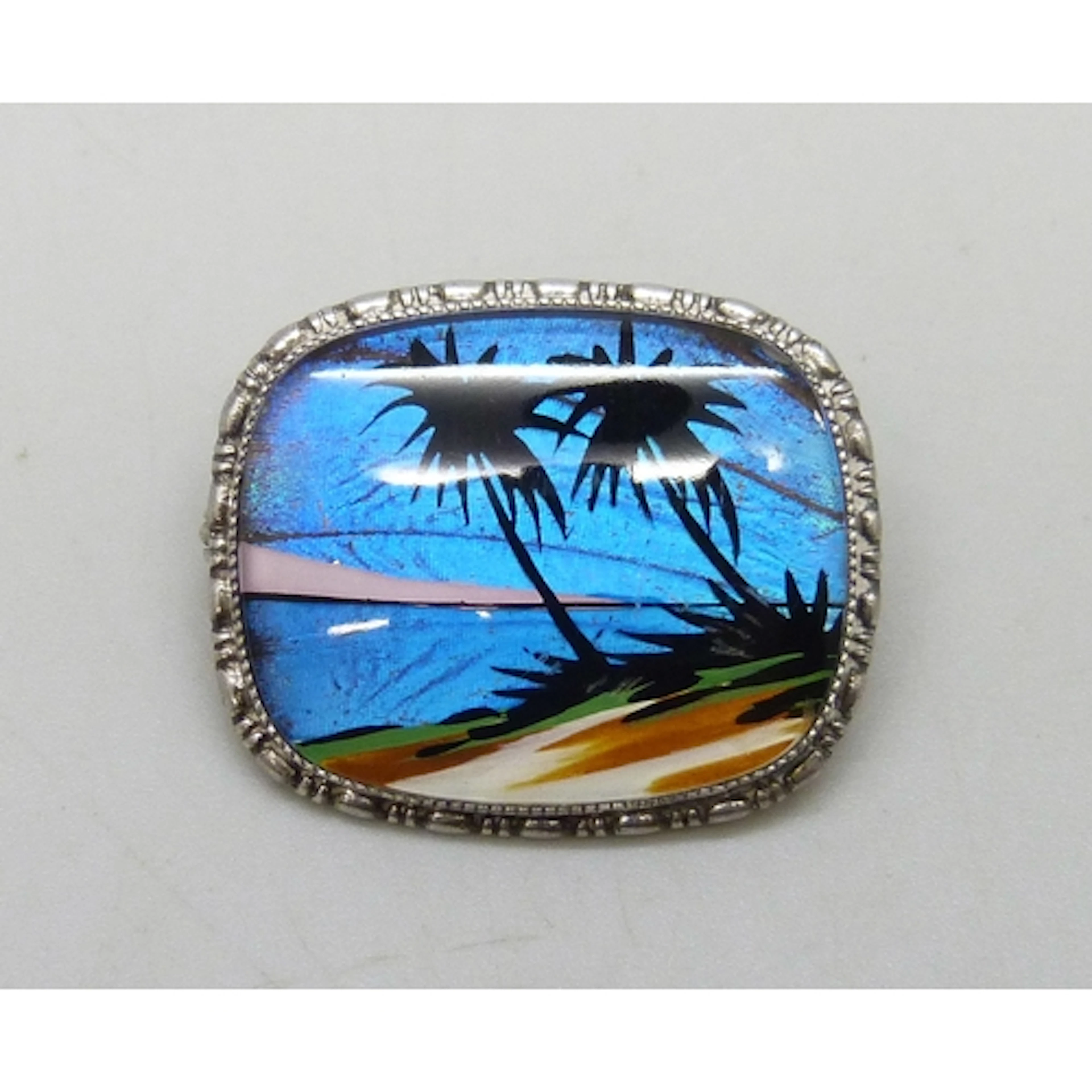 Thomas Mott, an Art Deco silver and butterfly wing brooch wi...