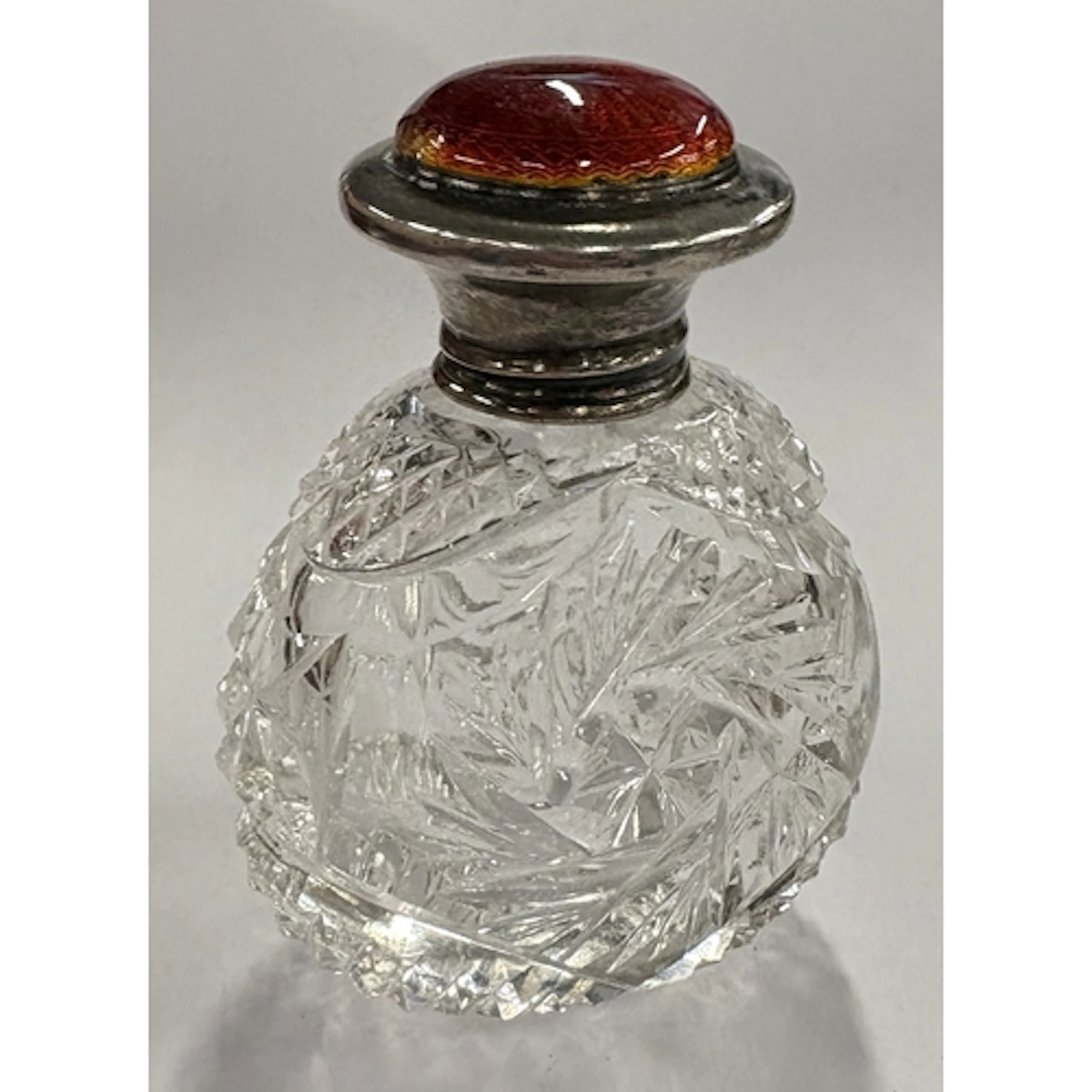 A silver and red enamelled glass scent bottle. Birmingham 19...