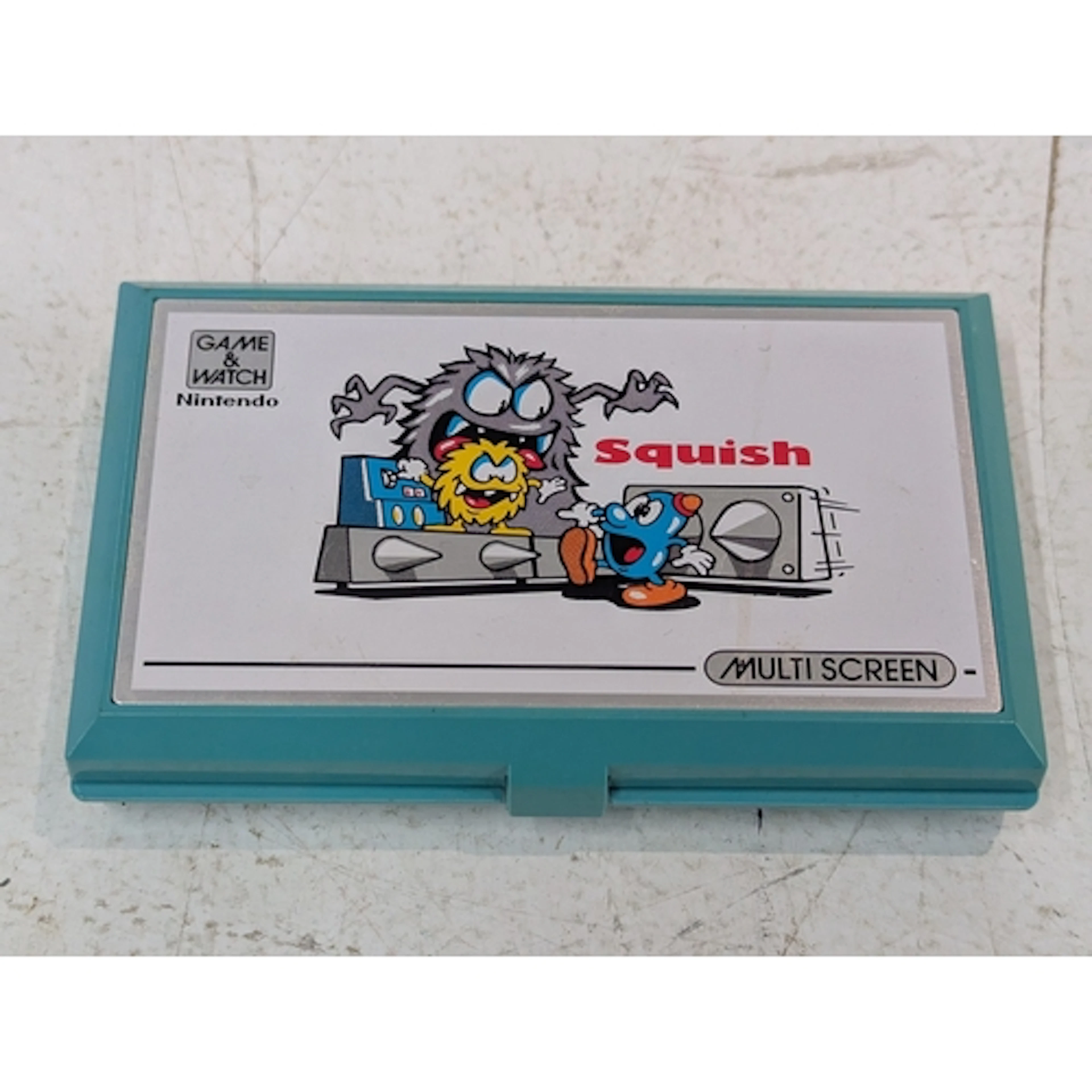 A vintage Nintendo game and watch Squish multi-screen Locati...