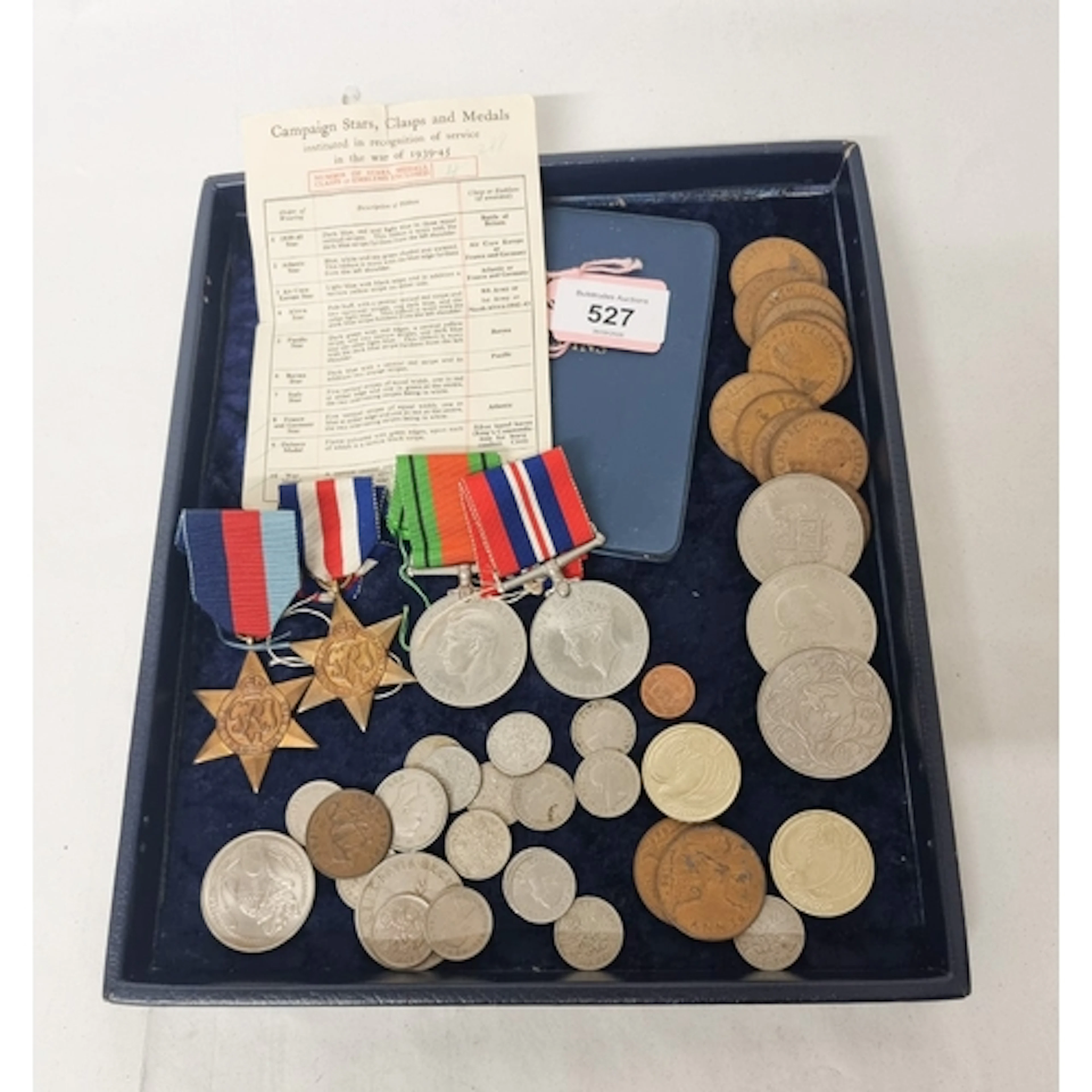 A group of Second World War medals and paperwork to include ...