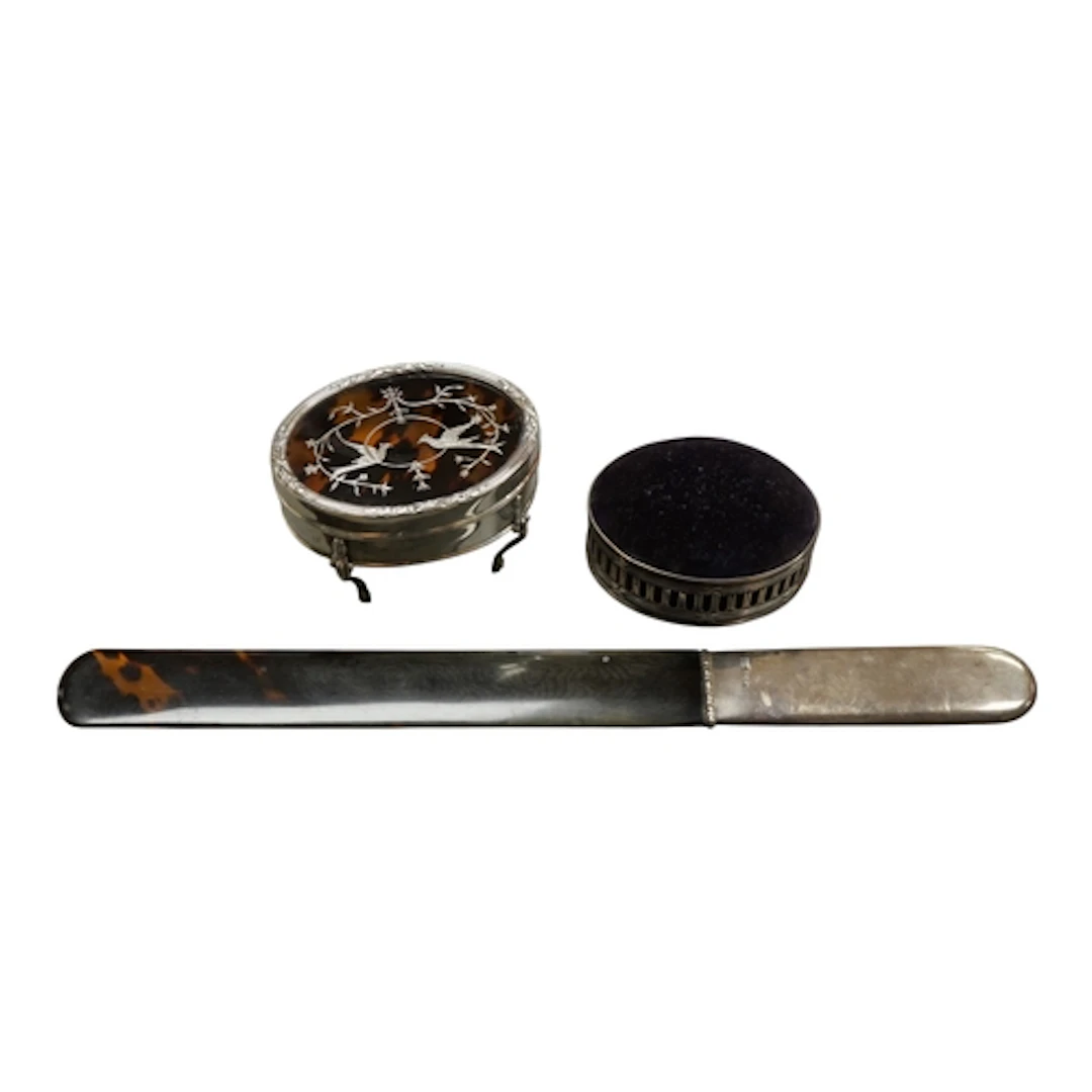 An Edwardian silver and tortoiseshell pique mounted oval tri...