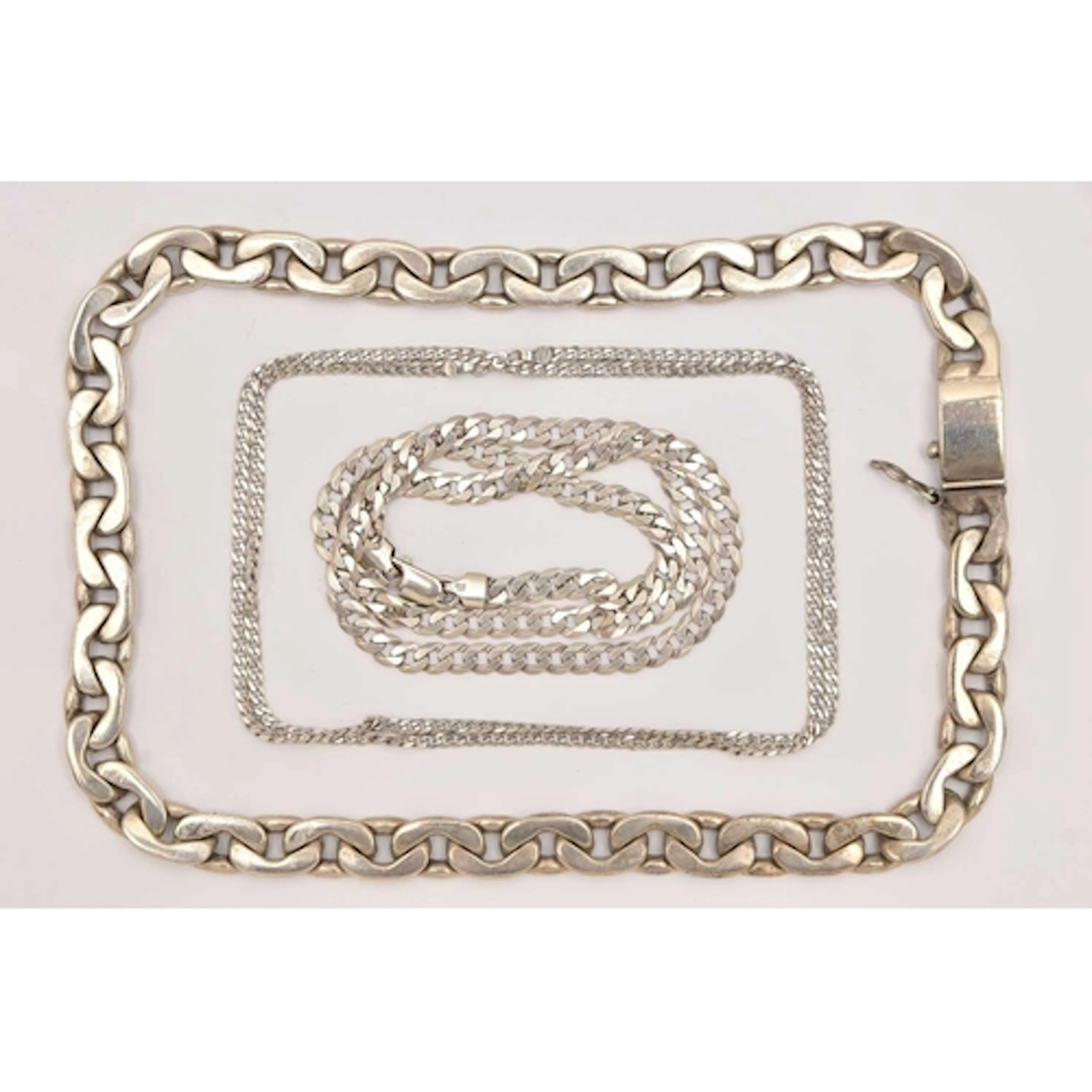 THREE CURB LINK CHAIN NECKLACES, a heavy silver curb link ch...